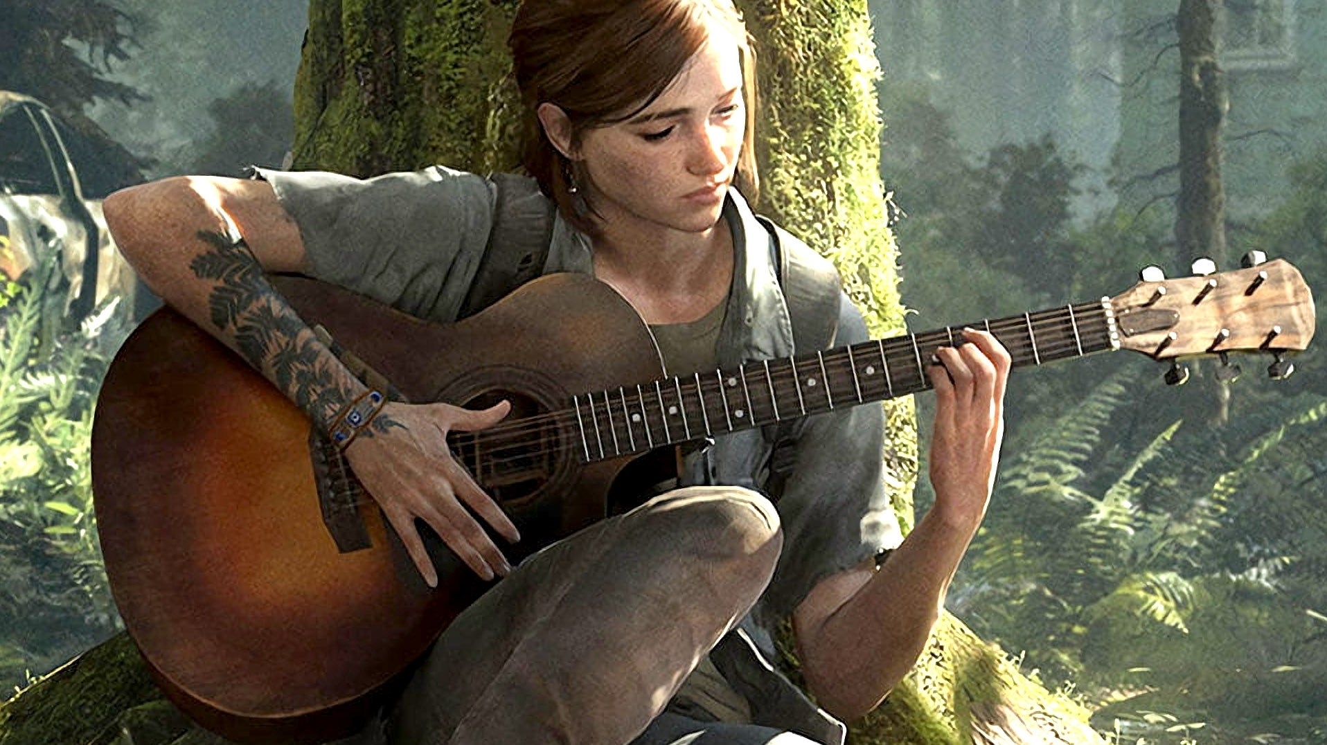 Ellie suona la chitarra nel bosco