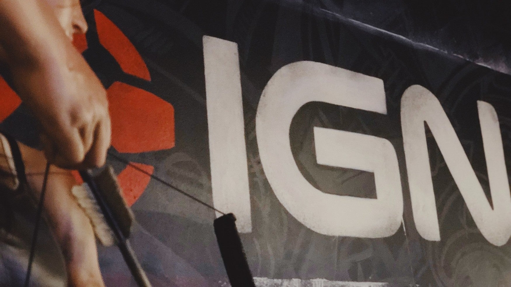 An IGN logo on the wall with what appears to be a Lara Croft statue in the extreme foreground