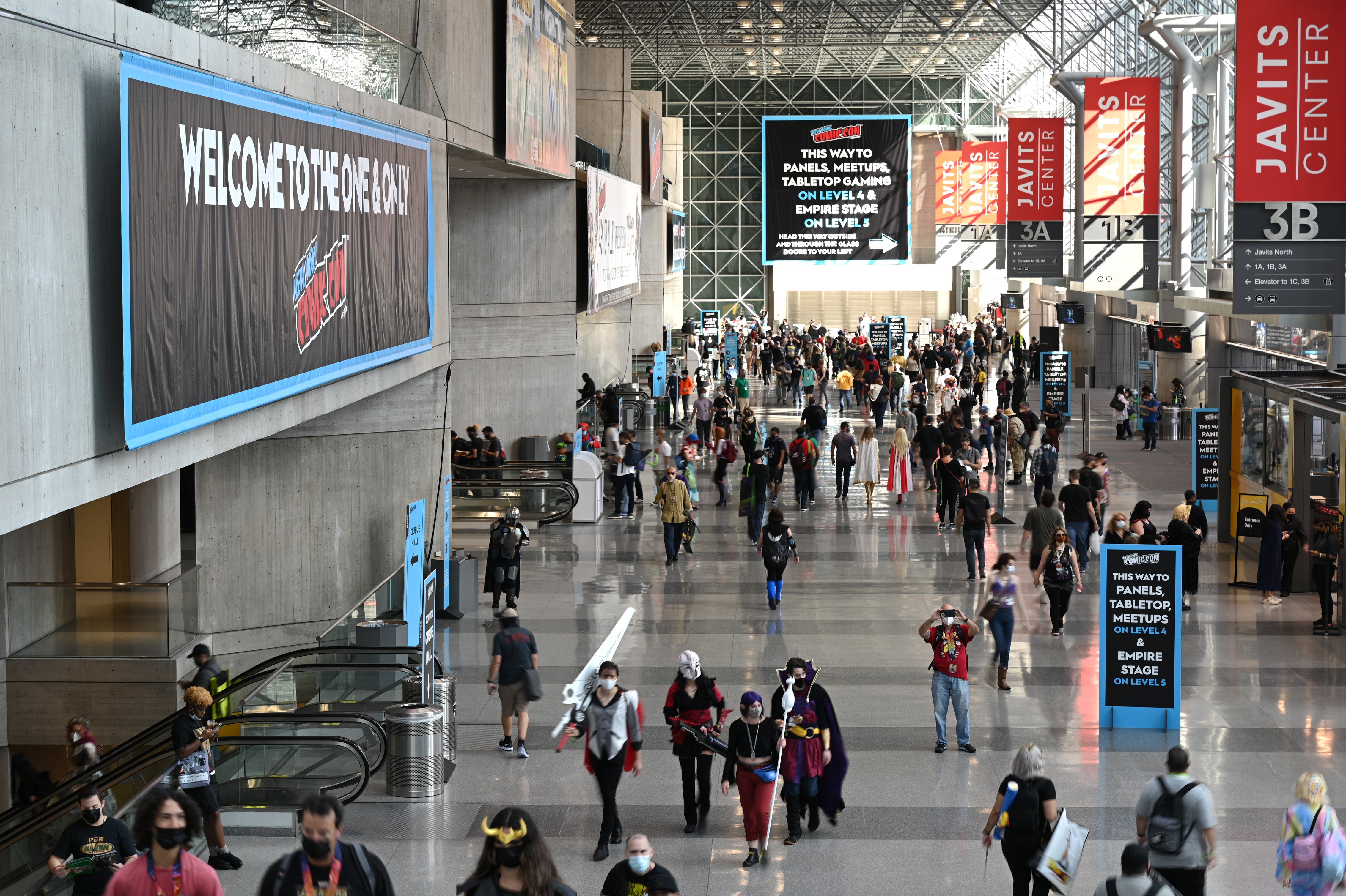 Interior of Javitz Center during New York Comic Con featuring masked convention goers