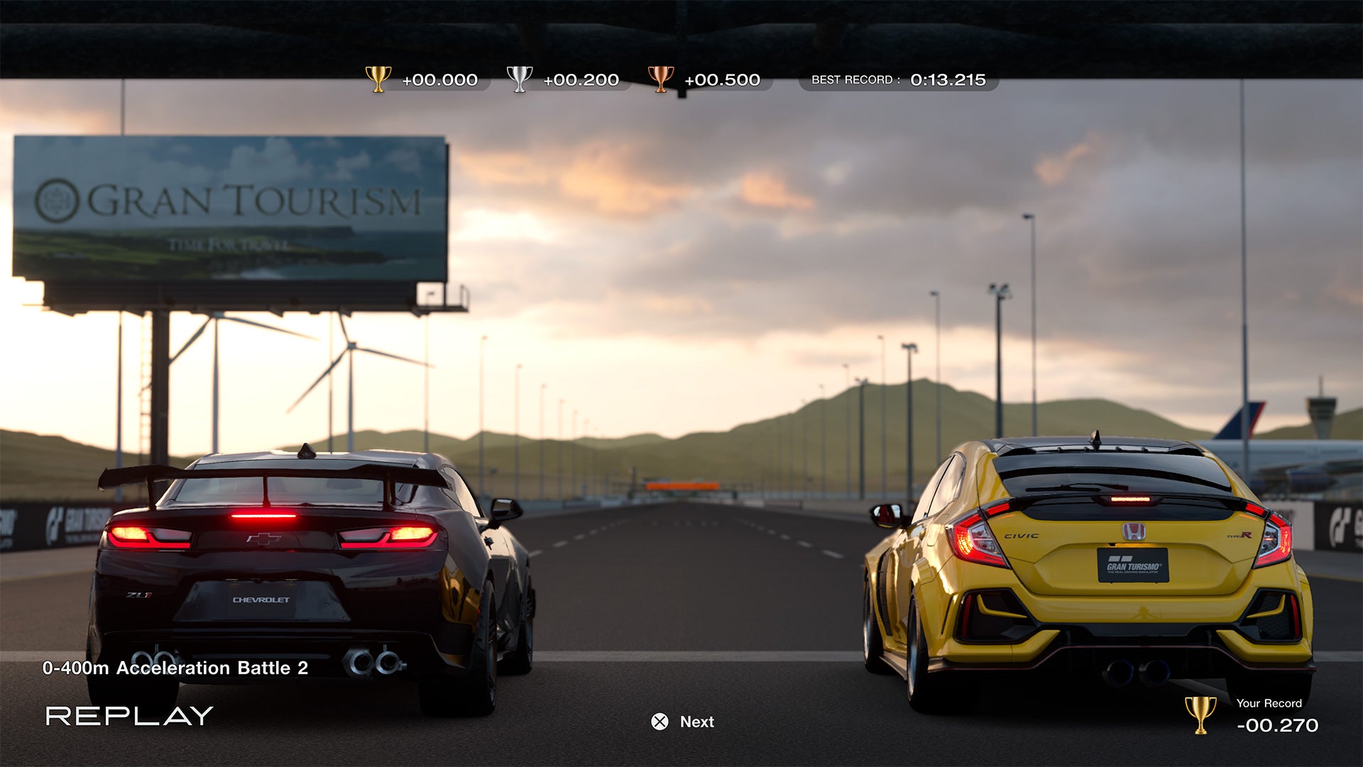 2022 best games Gran Turismo 7 - a black Chevrolet and yellow Honda Civic line up at the starting grid at dusk