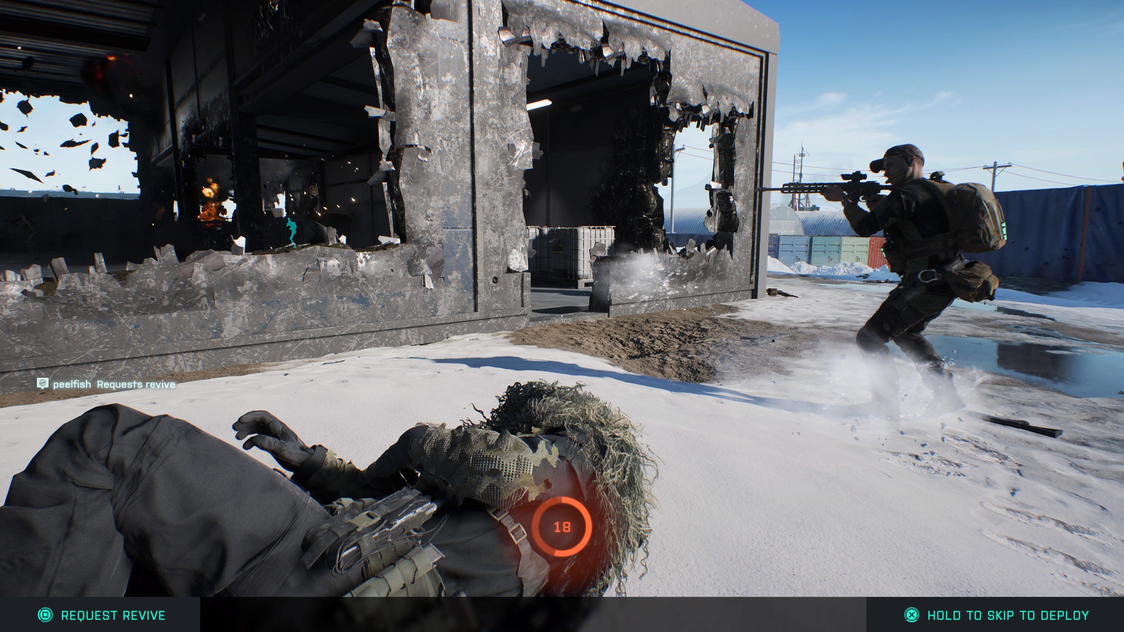 State of the Game Battlefield 2042 - a teammate on the floor in front of you that you're reviving, with another firing through a hole in a destroyed building