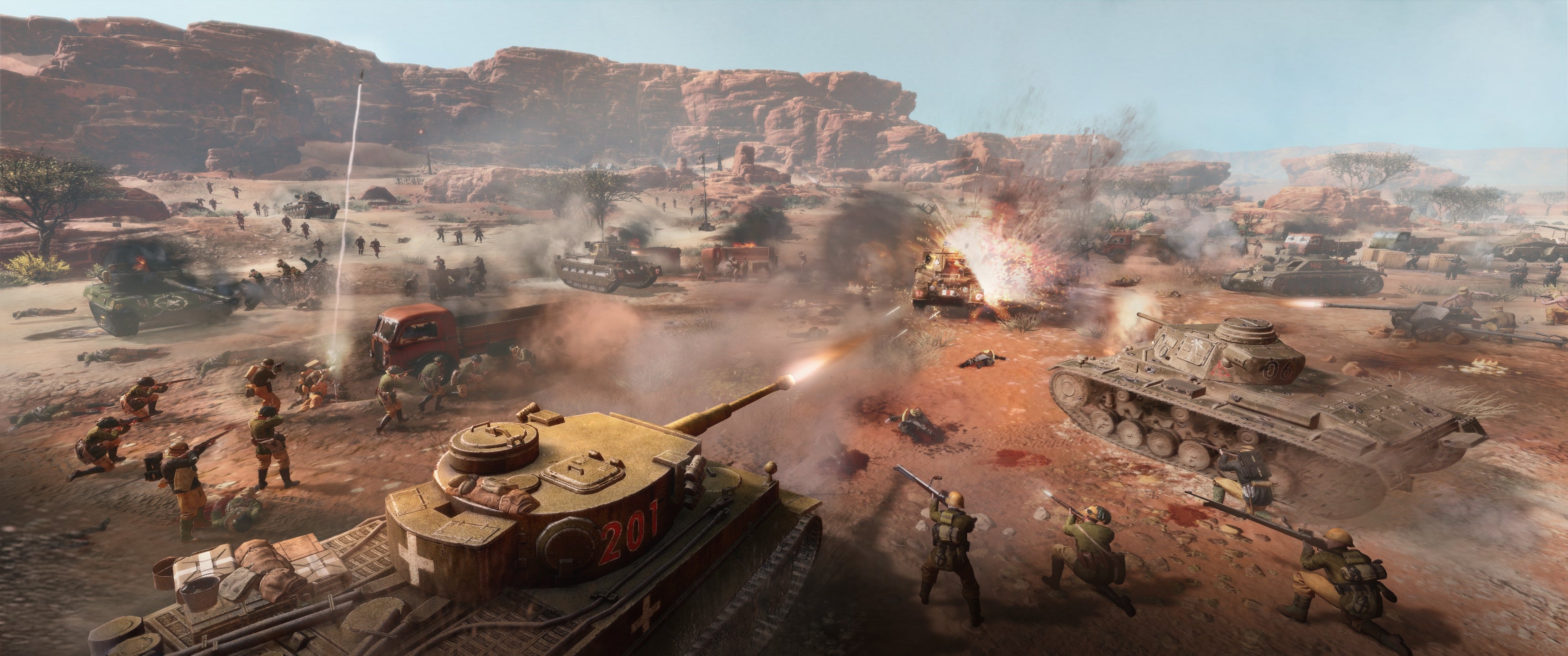 Company of Heroes 3 preview - an edited action shot of tank warfare and Campbell's Convoy in the desert