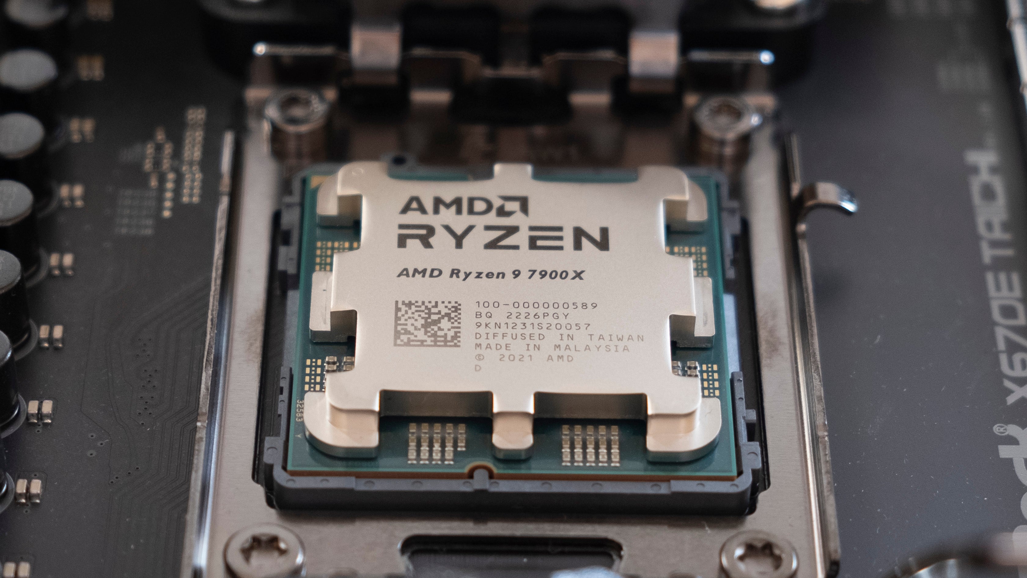 an amd ryzen 9 7900x processor, shown on a computer motherboard