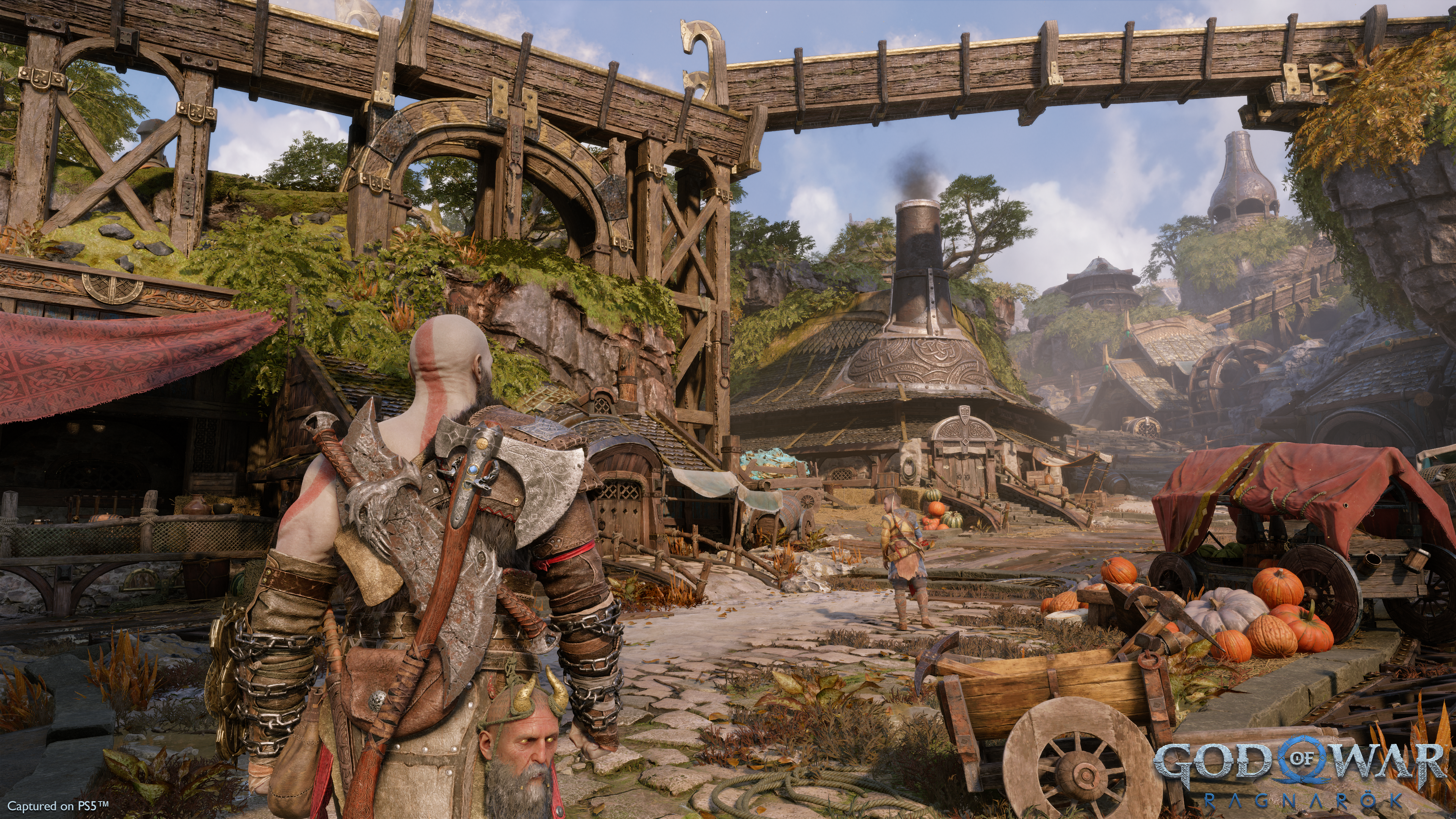 God of War preview - Kratos enters a kind of rural town in the Dwarf realm.