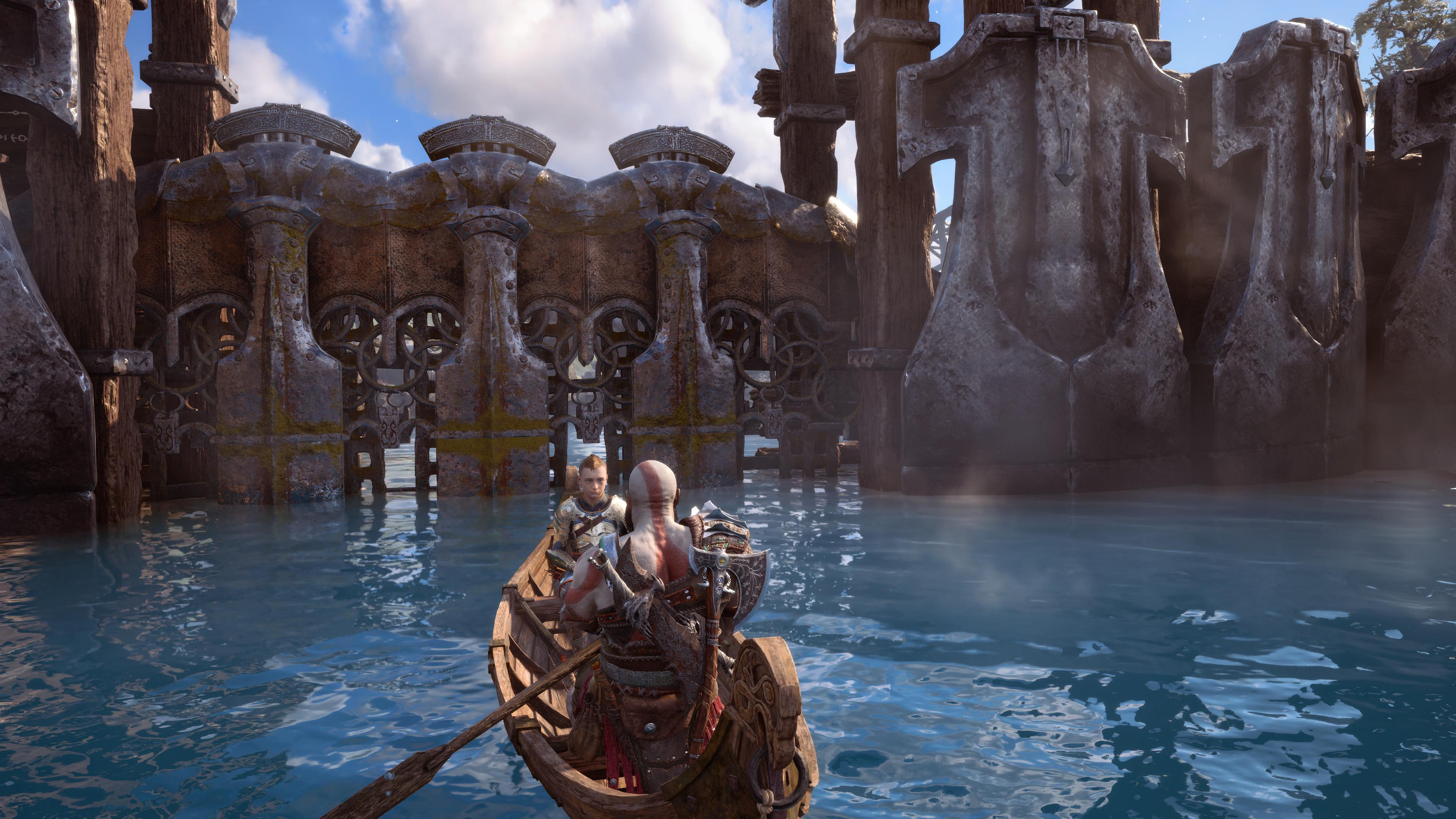 God of War Ragnarok review - Kratos and Atreus paddle towards a locked gate