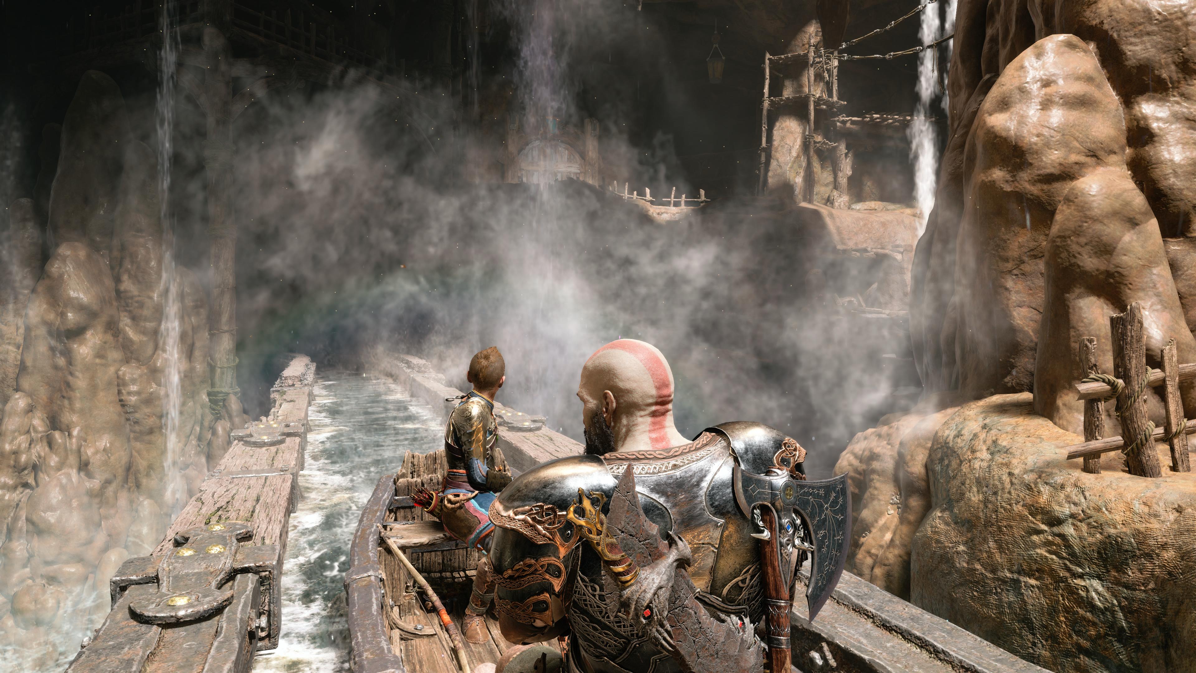 God of War Ragnarok review - Kratos and Atreus ride a log flume-style boat through the mines