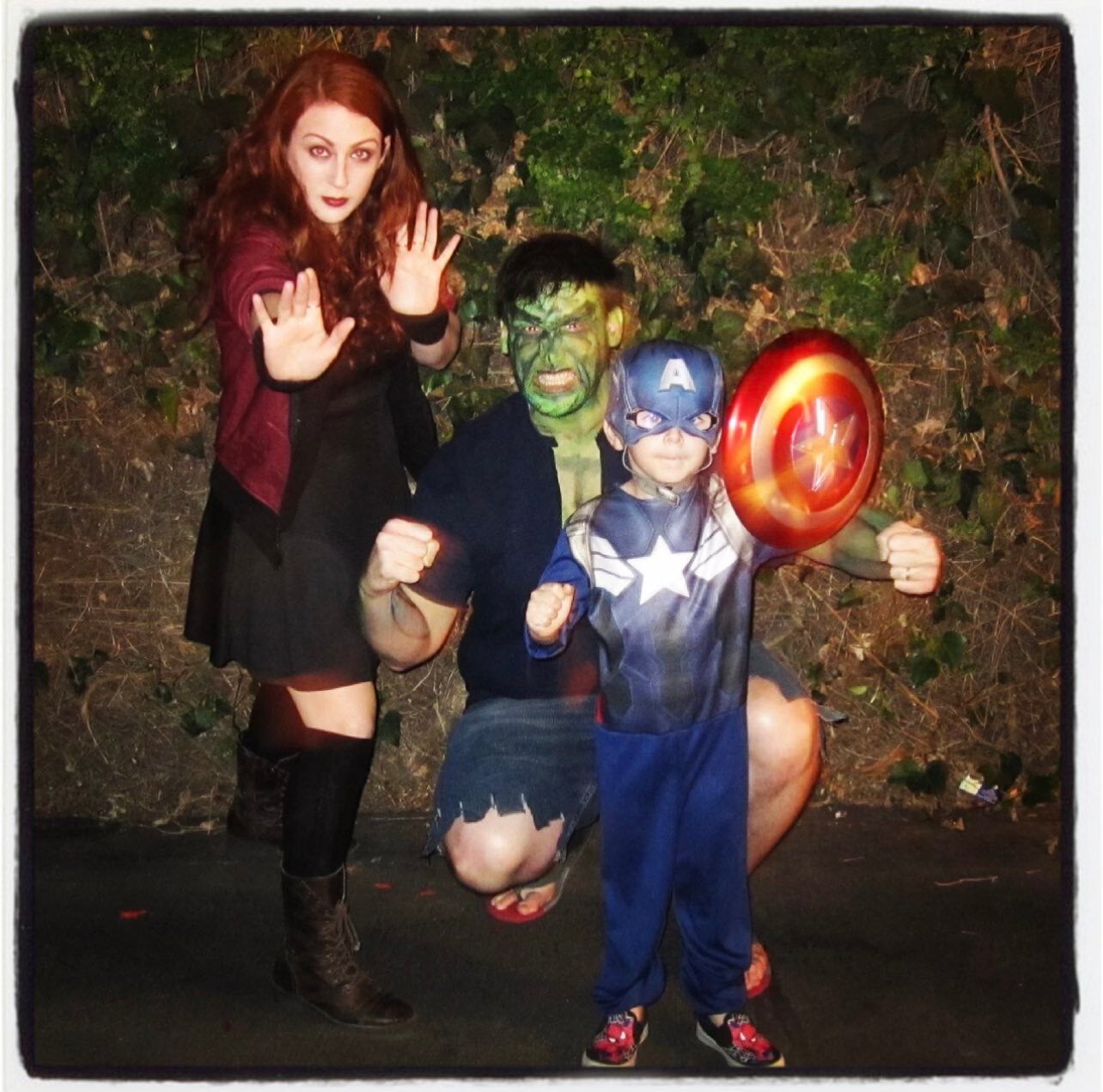 Julian Hilliard dressed as Captain America, Justin Hilliard (father) as the Hulk, and Arianne Martin (mother) as Wanda