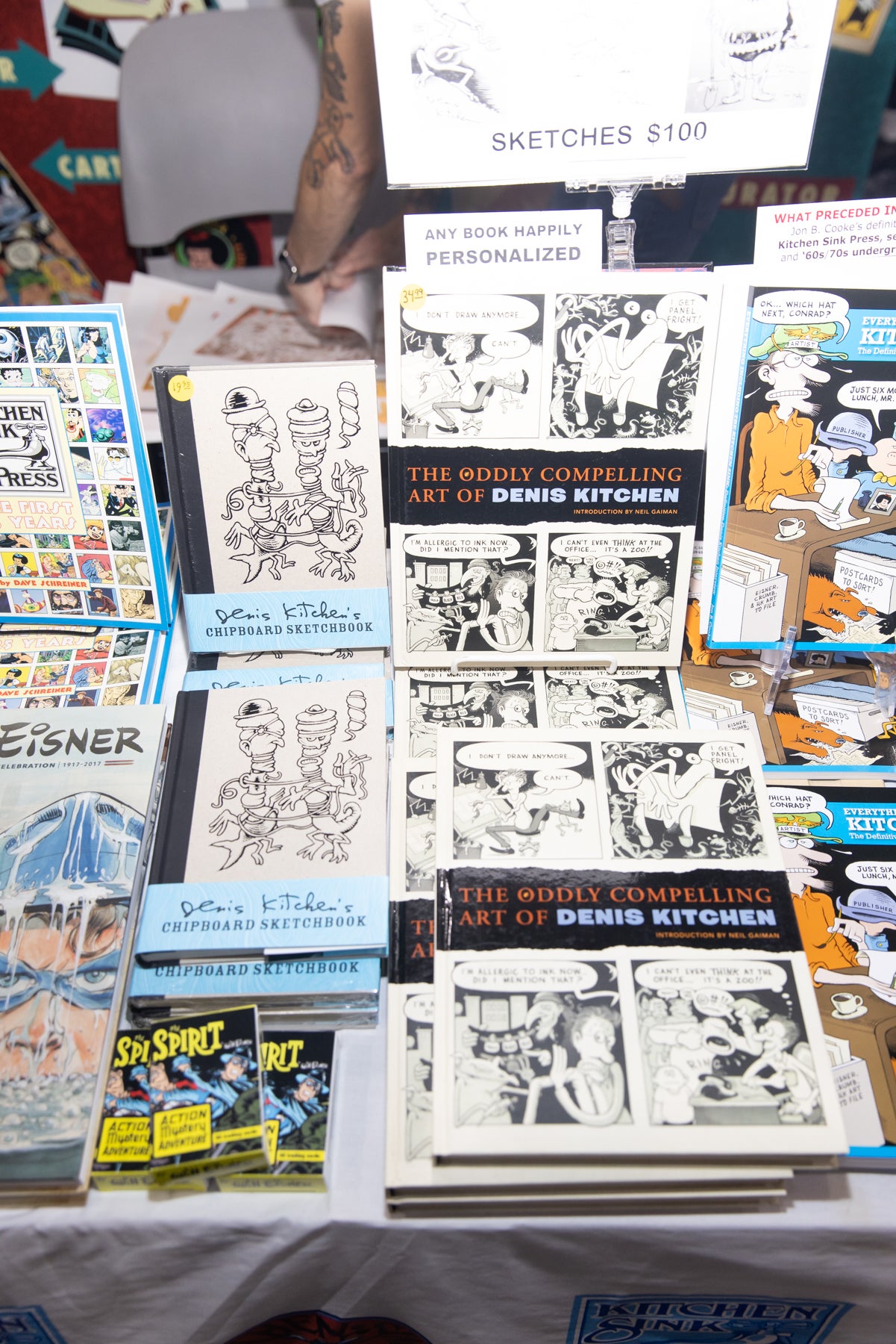 Photograph of books on display at Denis Kitchen's Artist's Alley table