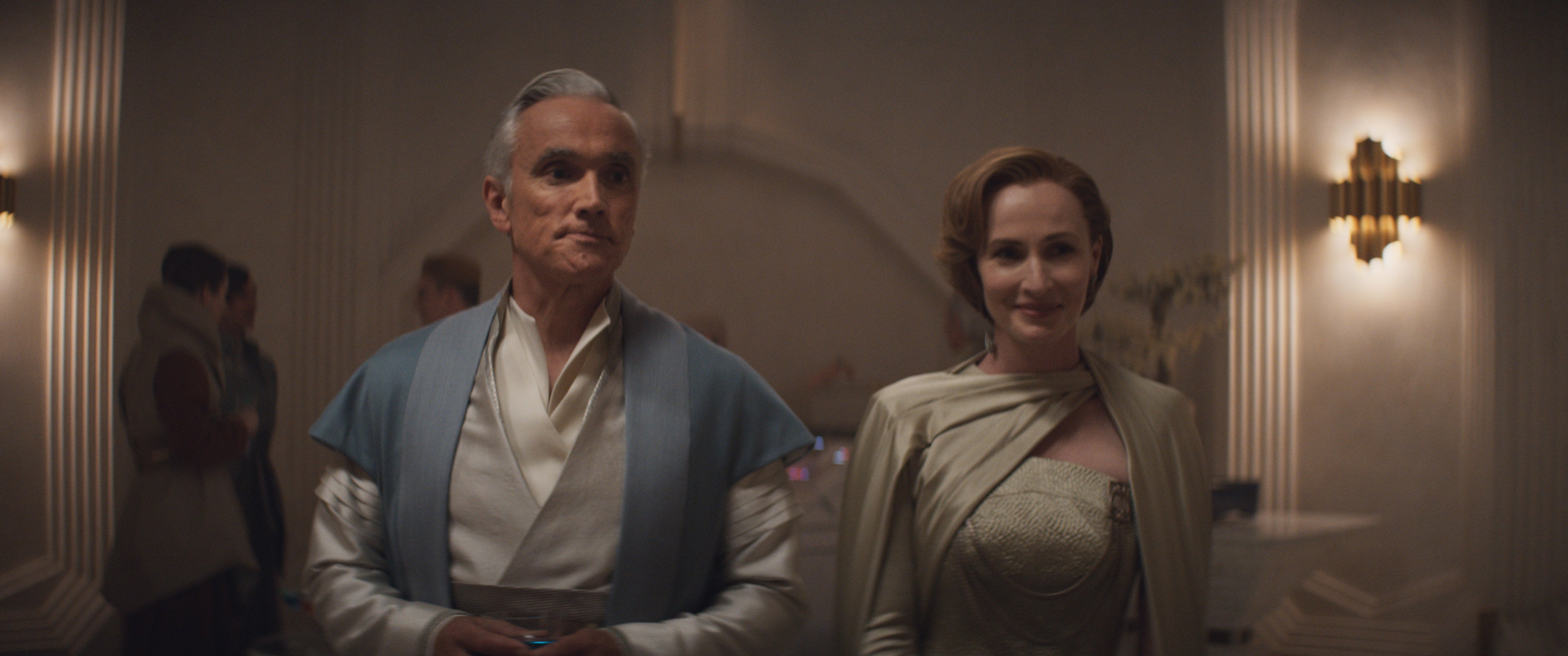 Mon Mothma smiles while walking with her husband