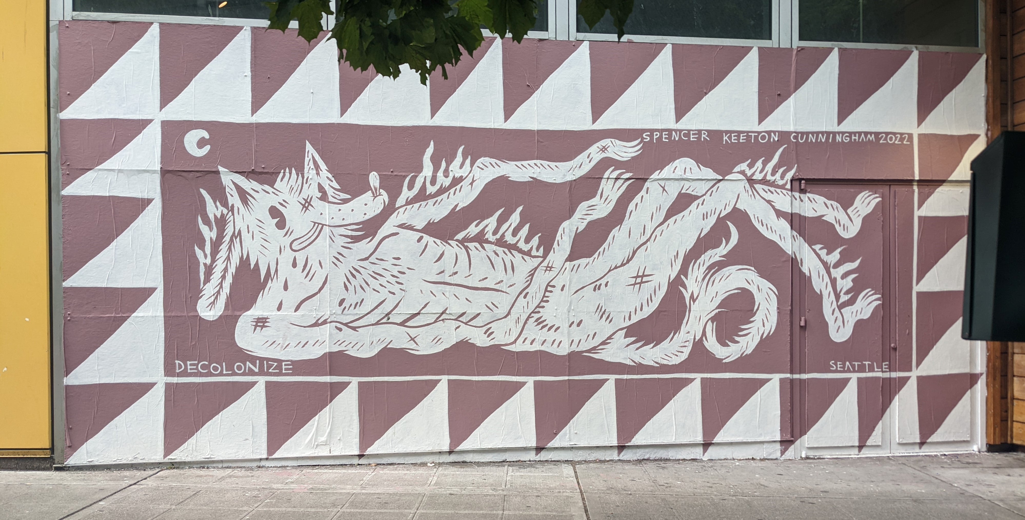 Photograph of a wall mural featuring a fox reposing