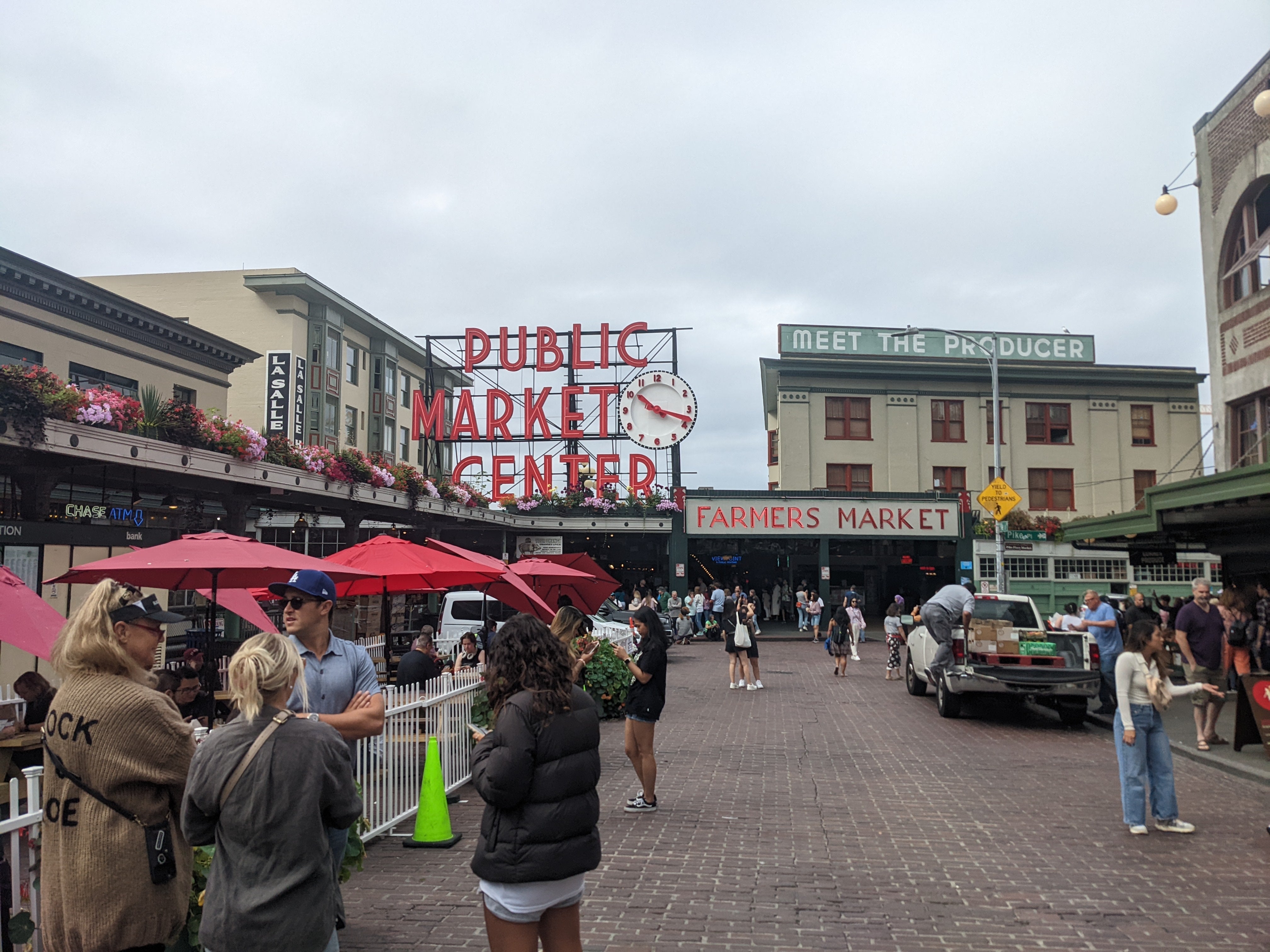 A photograph of a crowded Public Market Center on a grey day