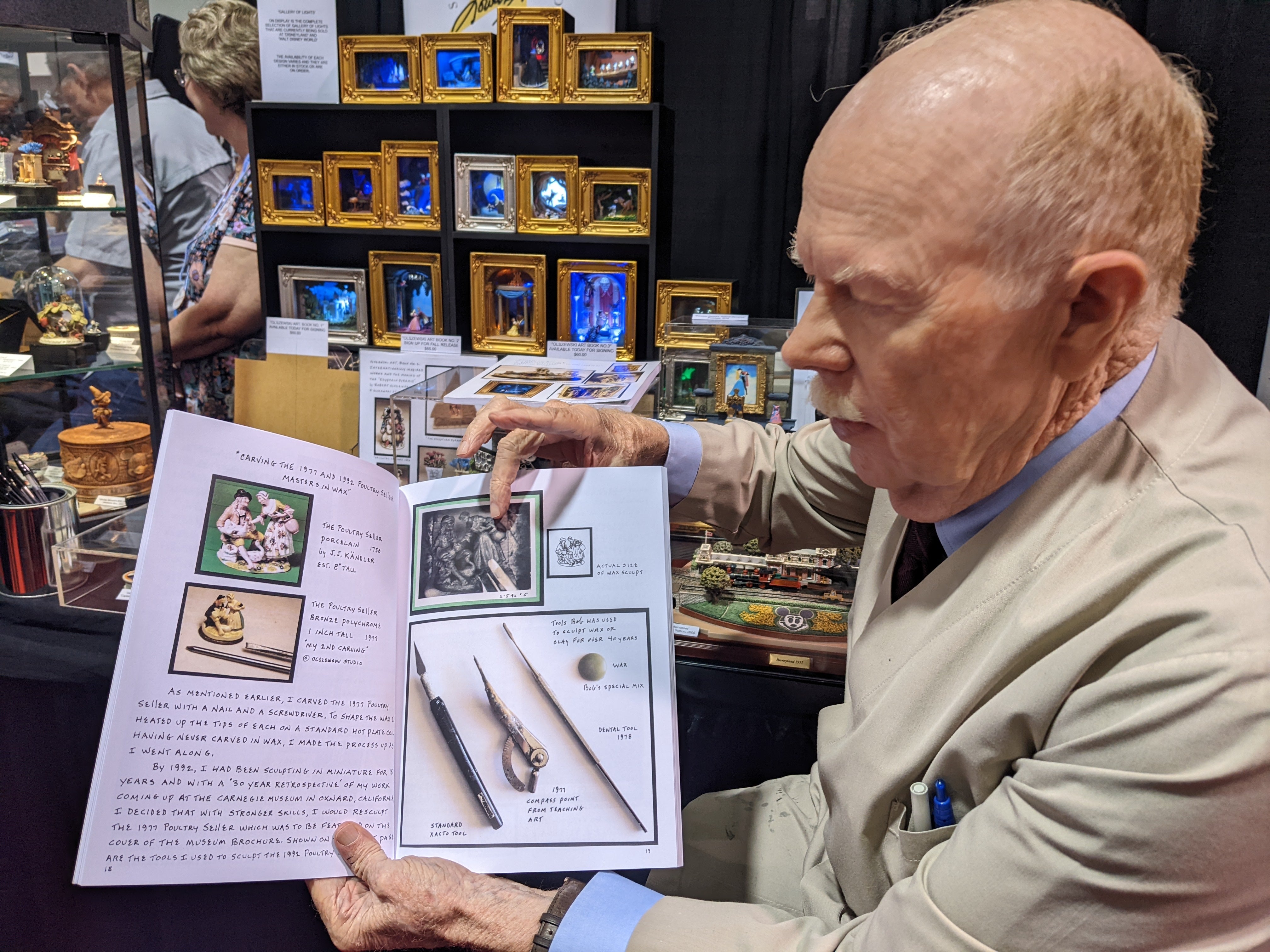 Bob Olszewski pointing out the tools he used in his book