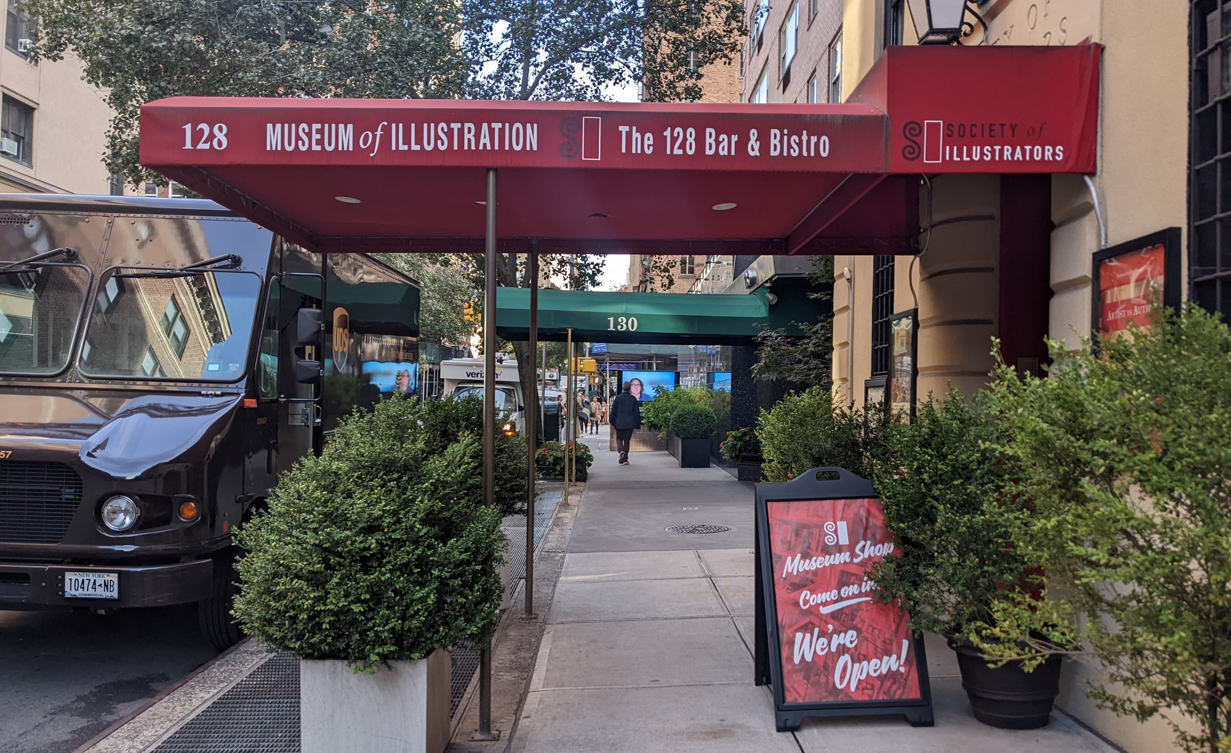 Exterior photo of the Society of Illustrators red awning from the side