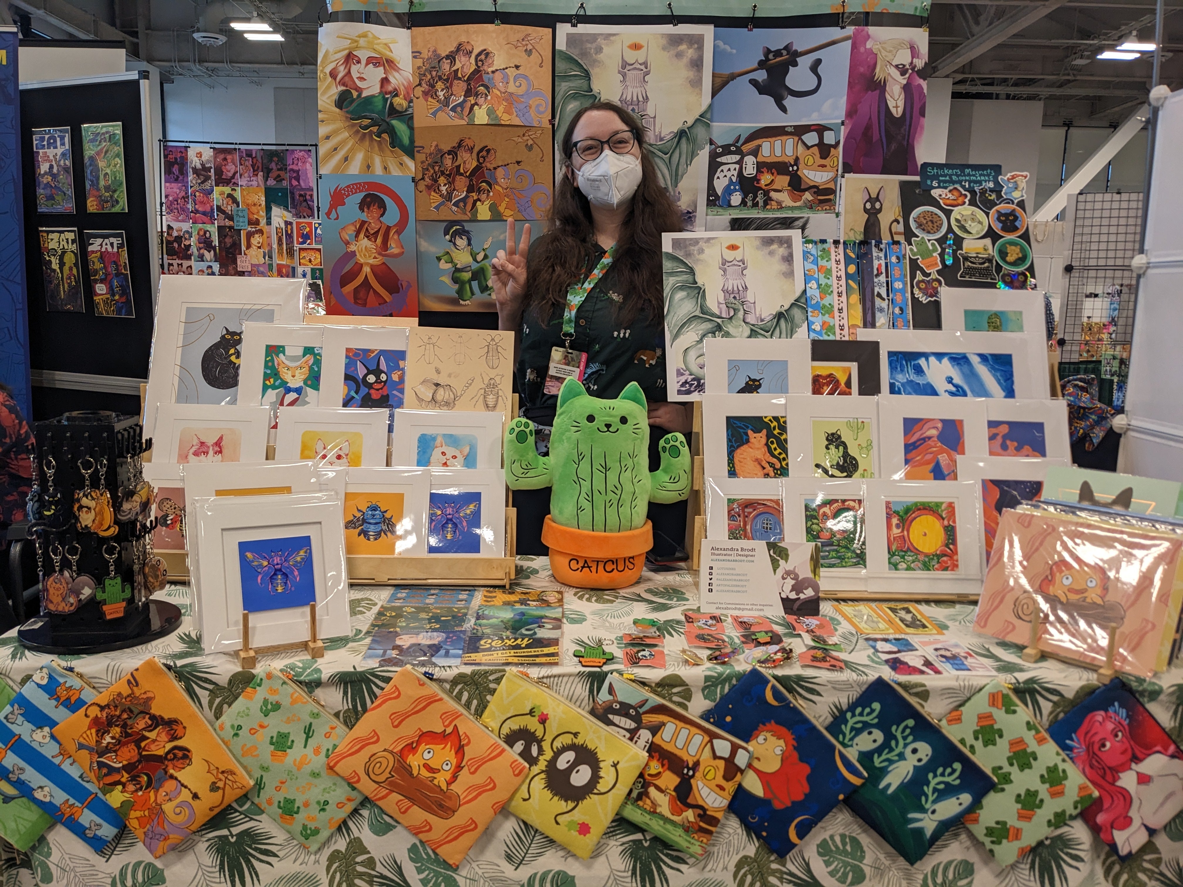 Photograph of artist behind her booth
