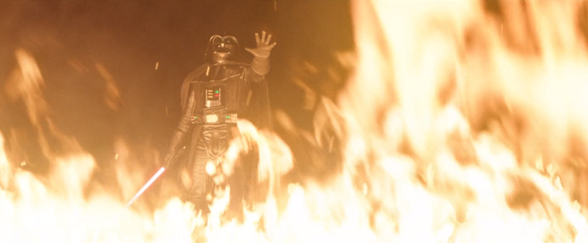 Image of Darth Vader using the force behind flames