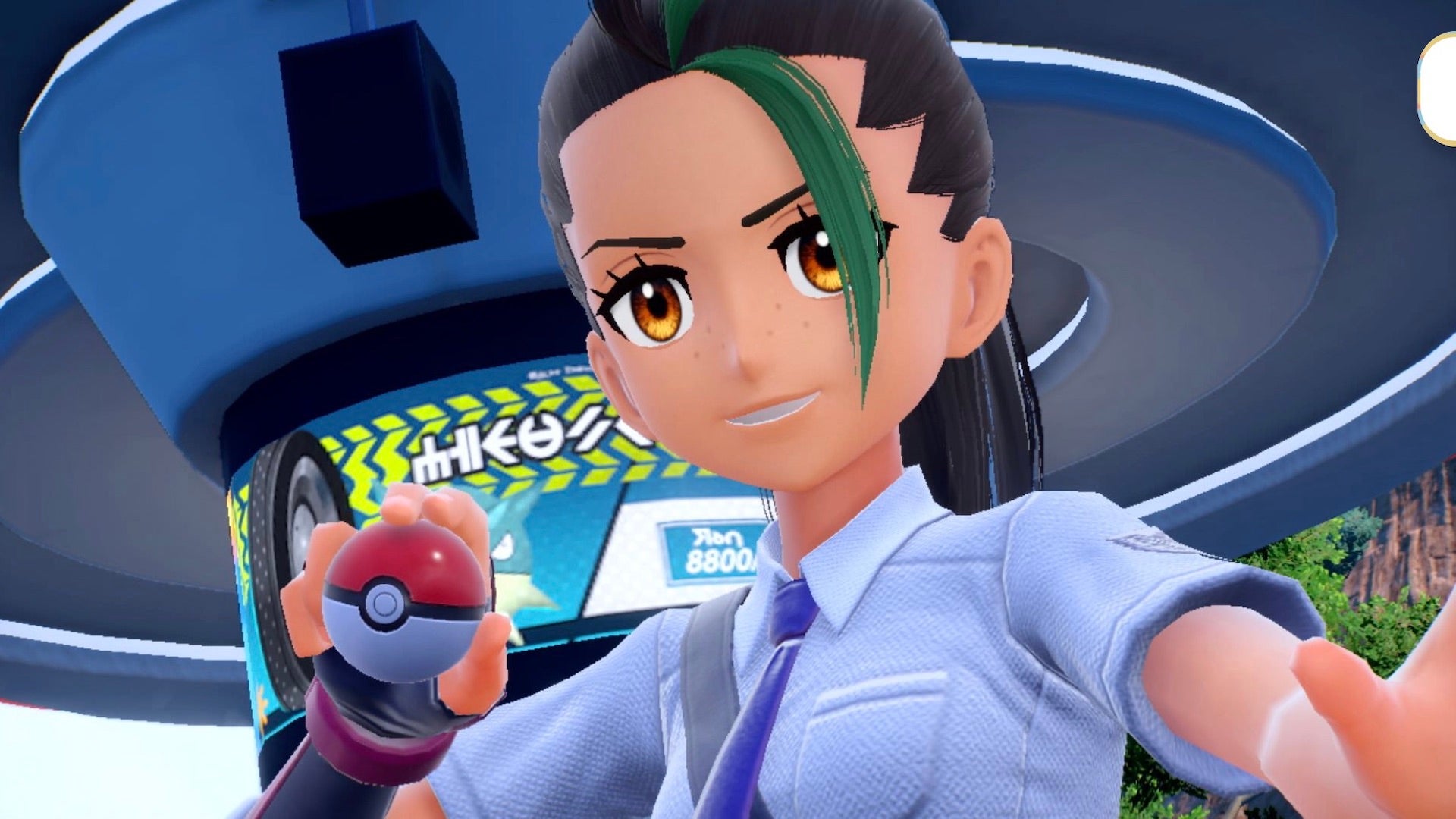 A Pokemon Trainer with green hair faces the camera holding a Poke Ball in their right hand