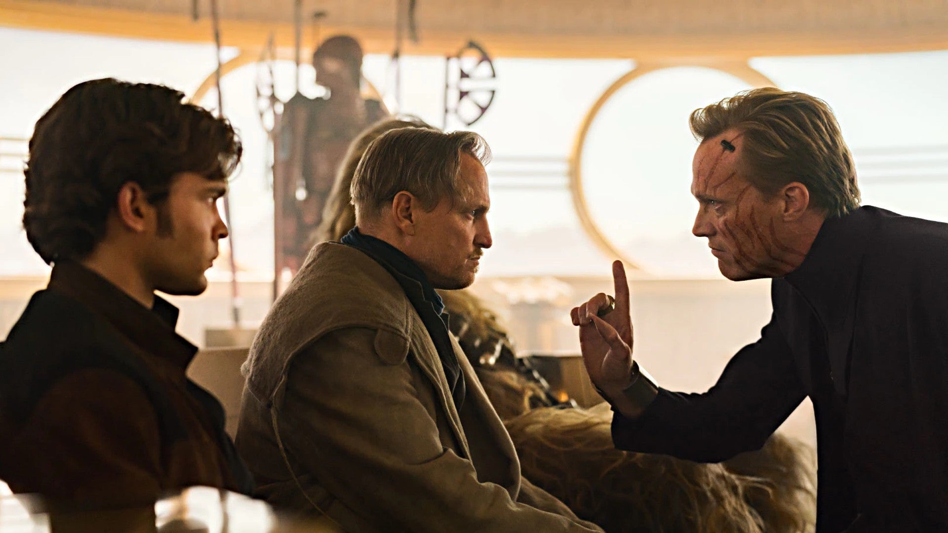 Solo: A Star Wars Story, Alden Ehrenreich as Han Solo and Woody Harrelson as Beckett speaking to Paul Bettany as Dryden Vos