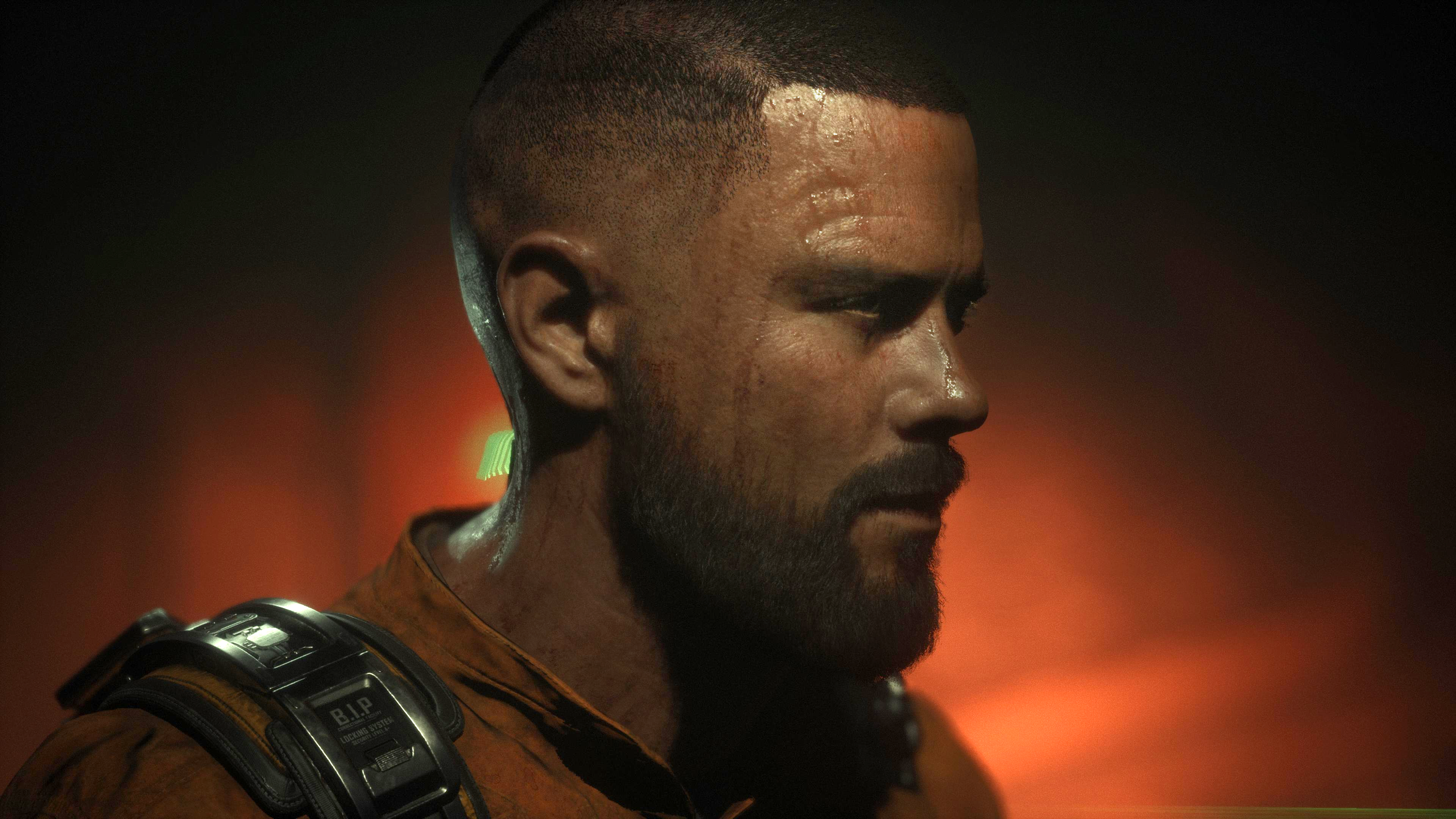 The Callisto Protocol - a side-profile of Jacob's face in orange lighting