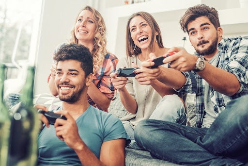 Group of adults playing a video game together