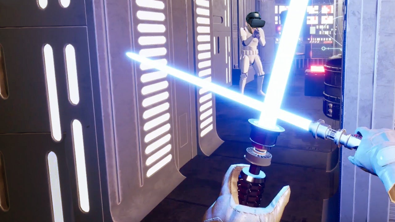A screen shot of the Star Wars Jedi Knight 2 VR Remaster demo taken from the first person perspective of someone holding two lightsabers. A Storm Trooper is in the background with Ian's head super imposed onto its body.