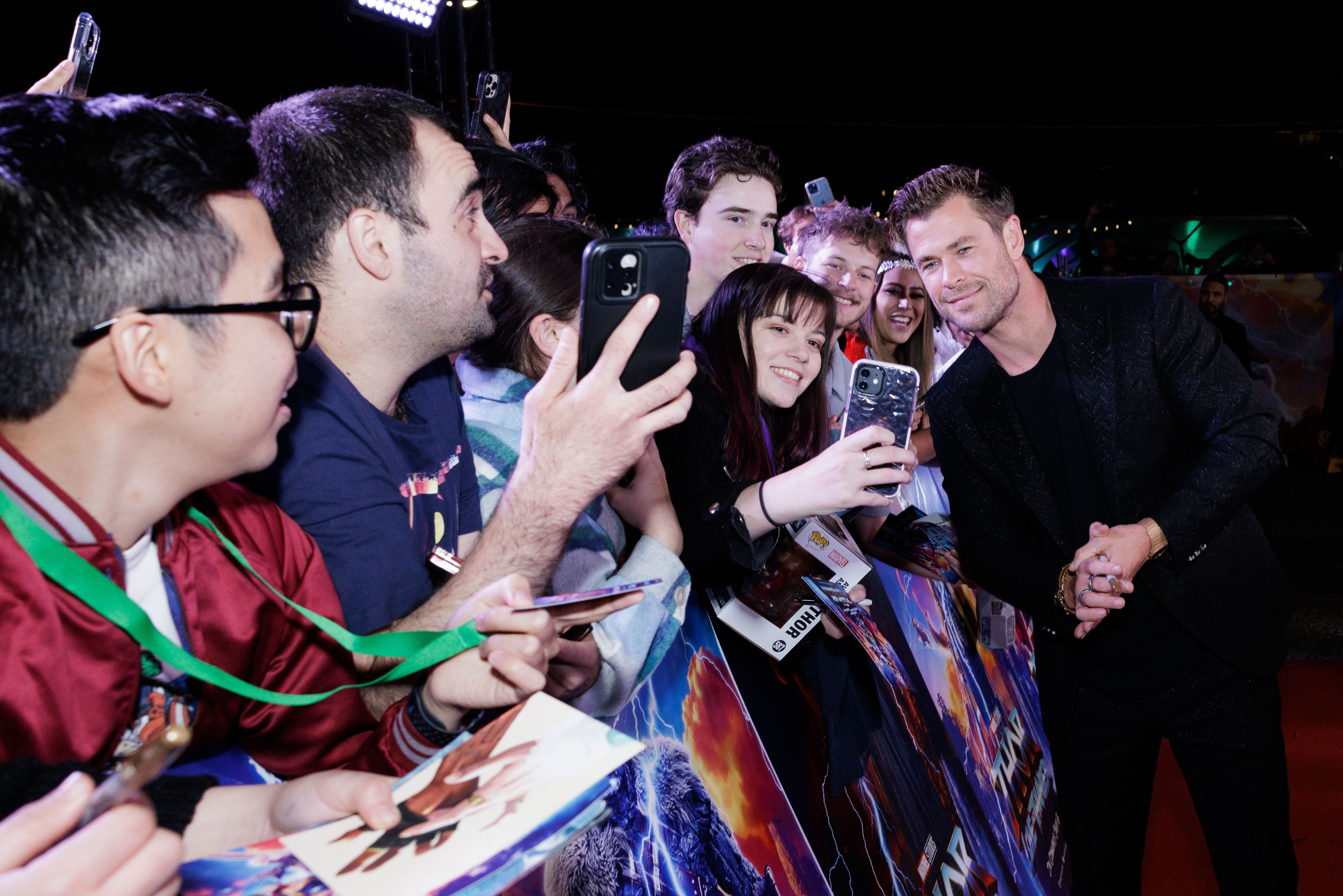 Chris Hemsworth taking photographs with fans