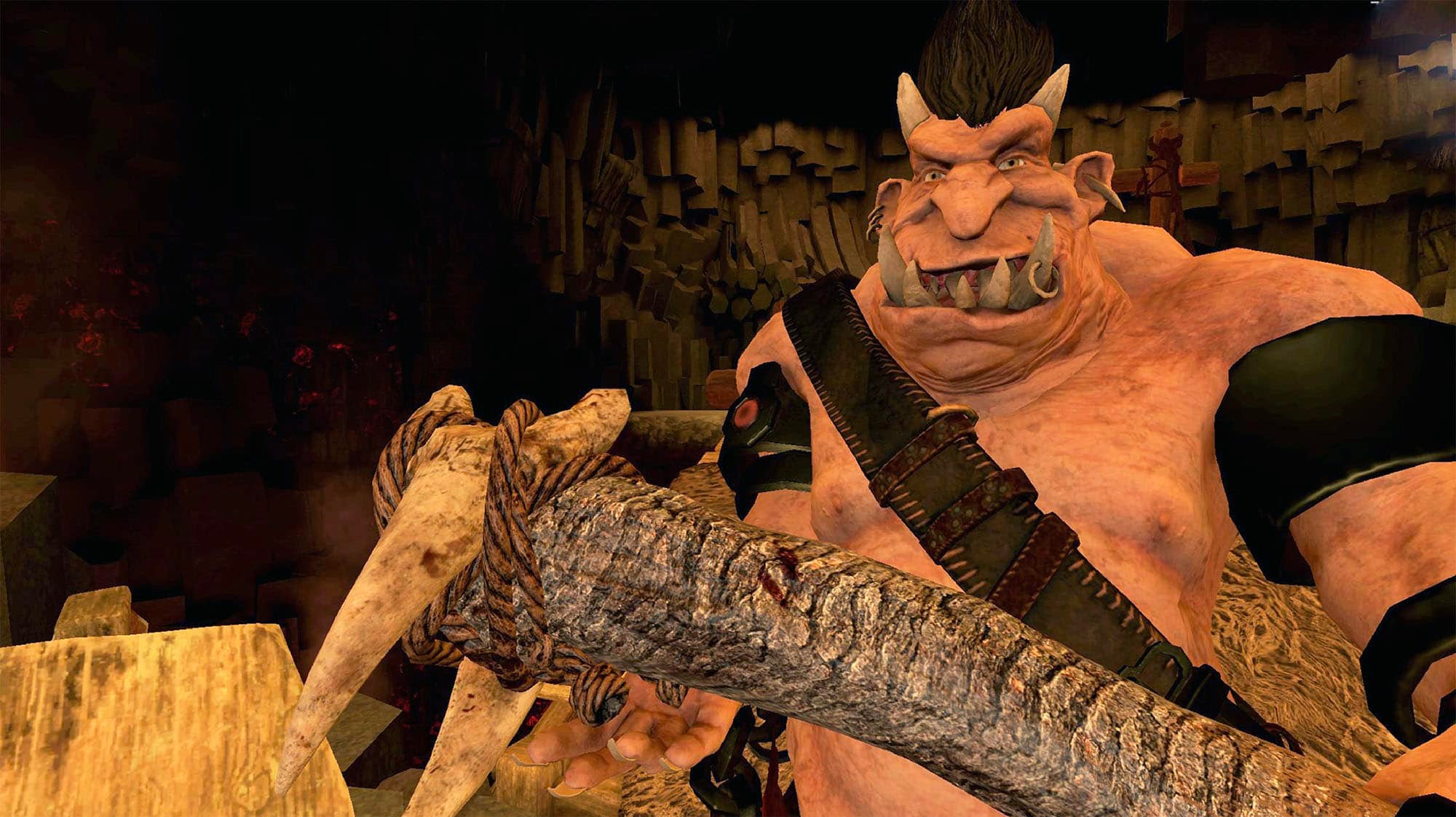A big, fat, ogre with a big, wooden club. It's got big teeth and some horns and is orange coloured.
