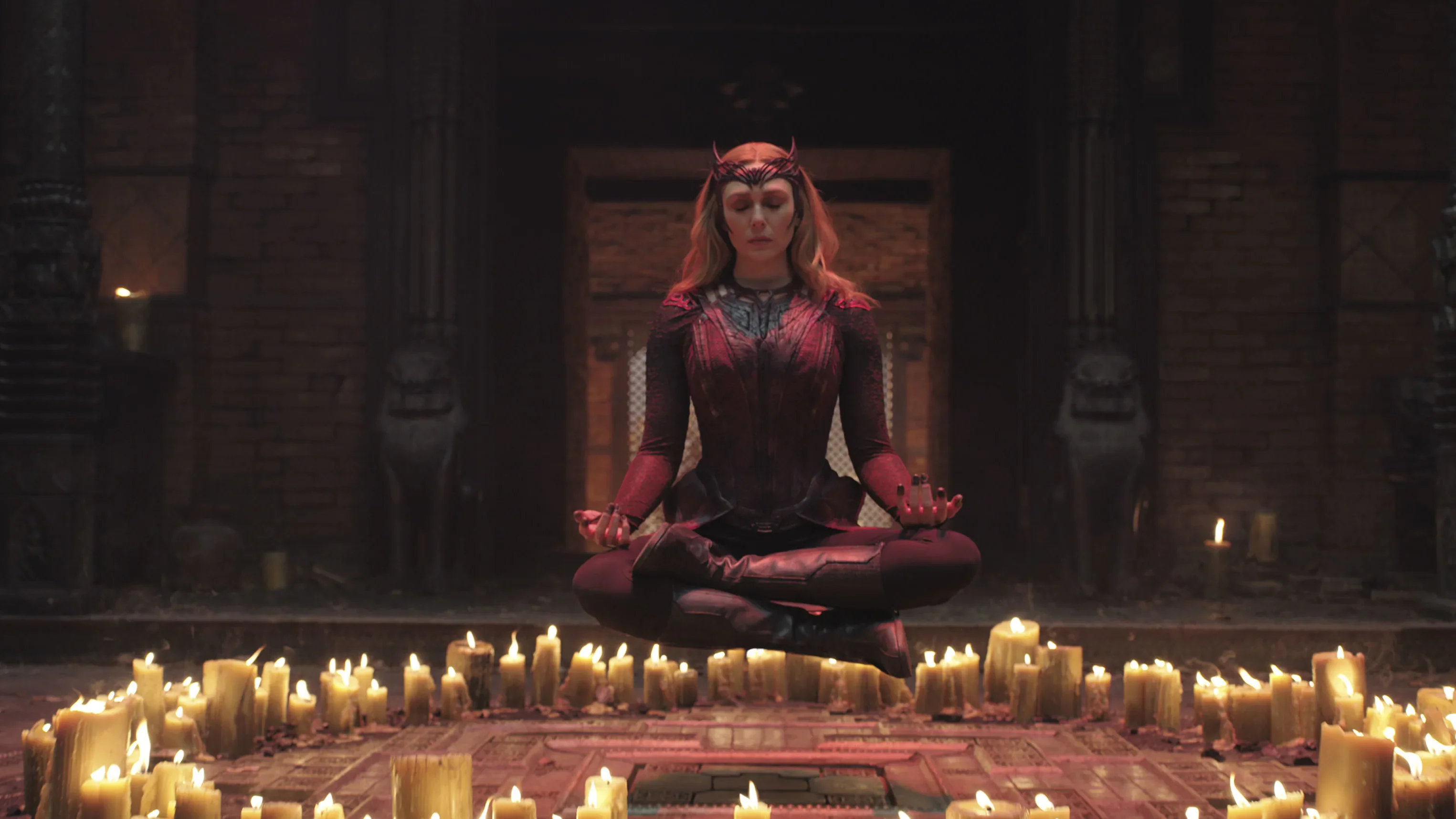 Scarlet Witch levitating above a circle of candles from Doctor Strange Multiverse of Madness