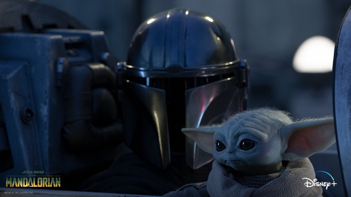 Still image featuring the Mandalorian and Grogu
