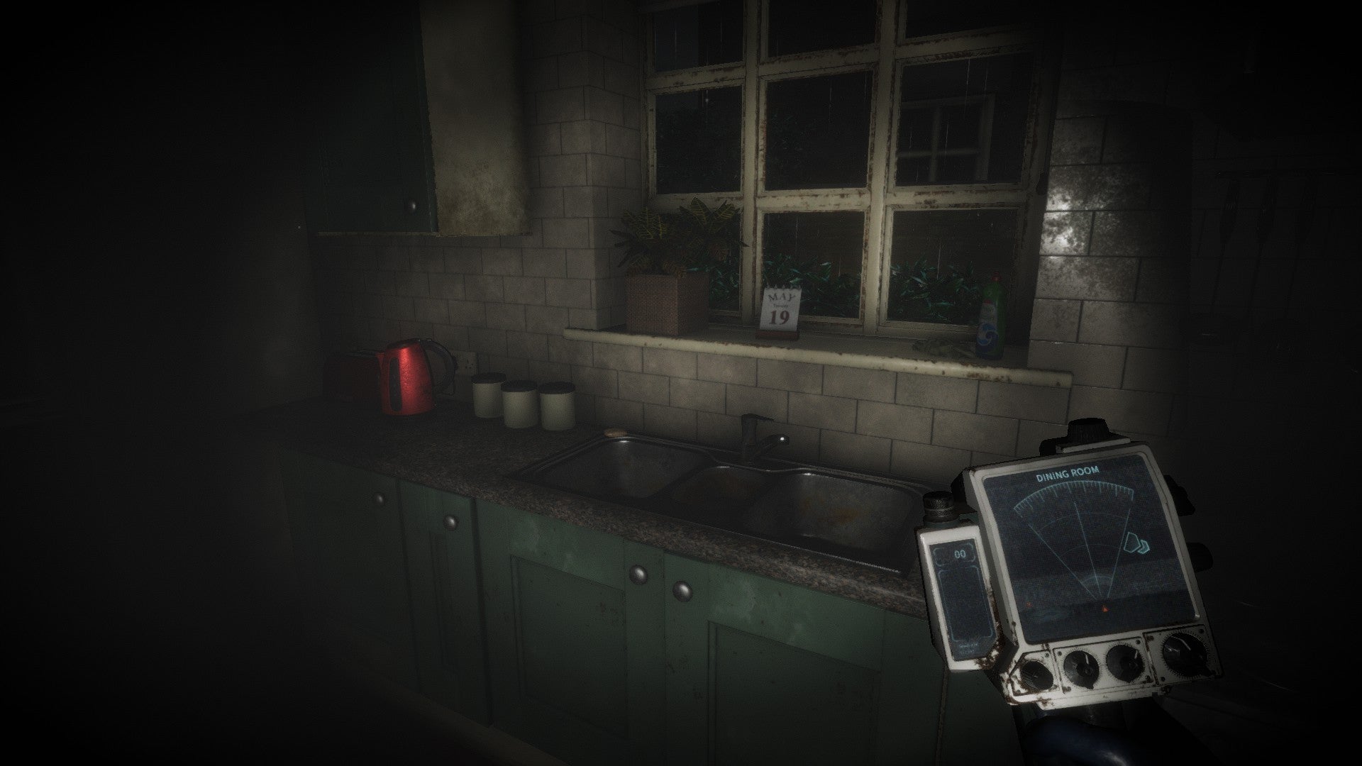 Eternal Threads Review - Scanner in right hand as you look at sink in dim kitchen