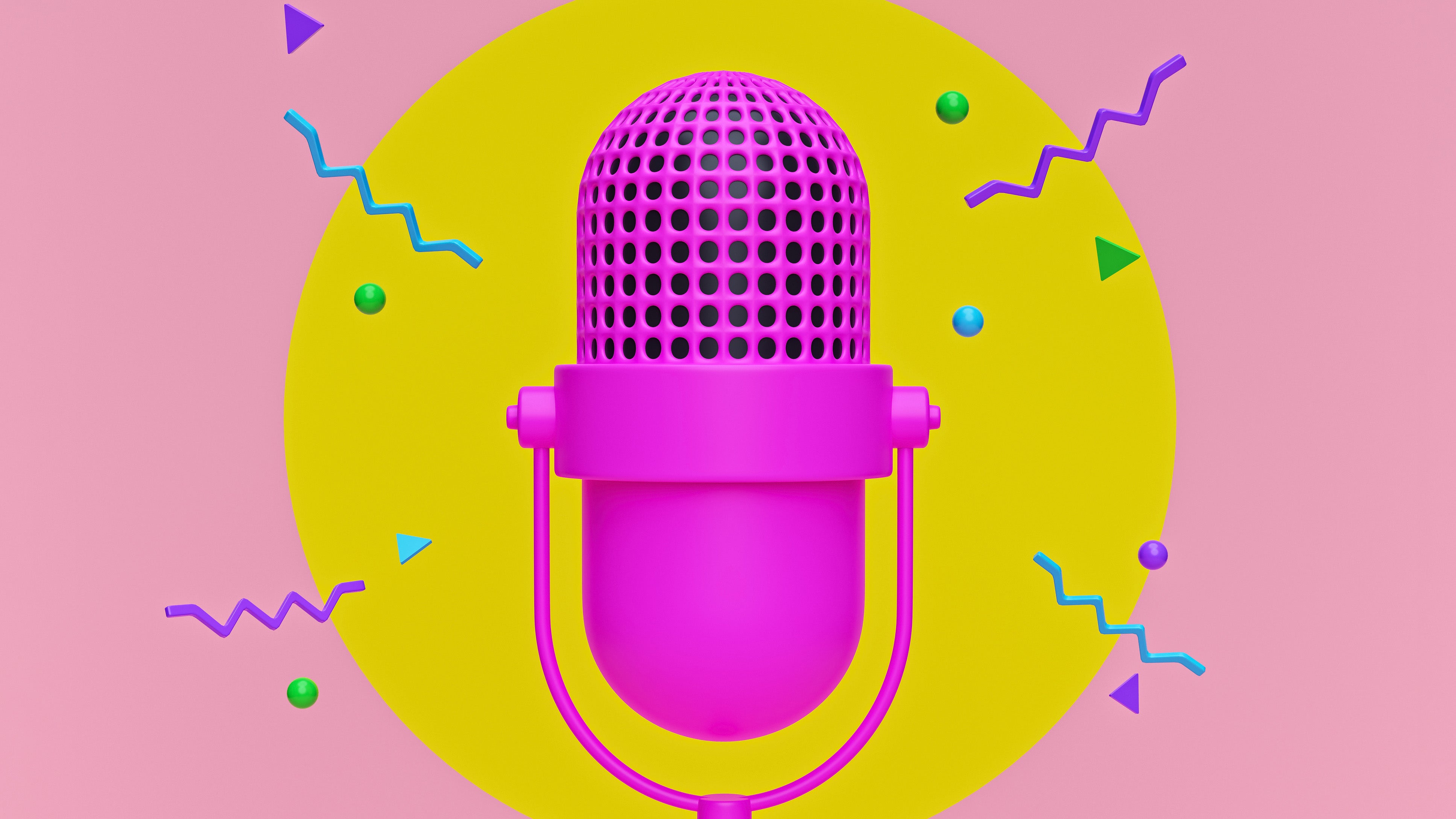 A bright pink podcast microphone with a yellow circular background and funky shapes dotted around. It's a party podcast picture if ever I saw one.