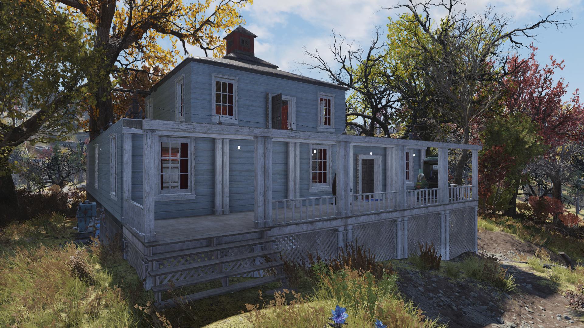 Fallout 76 State of the Game - a pretty wood-clad home painted baby blue with white railings