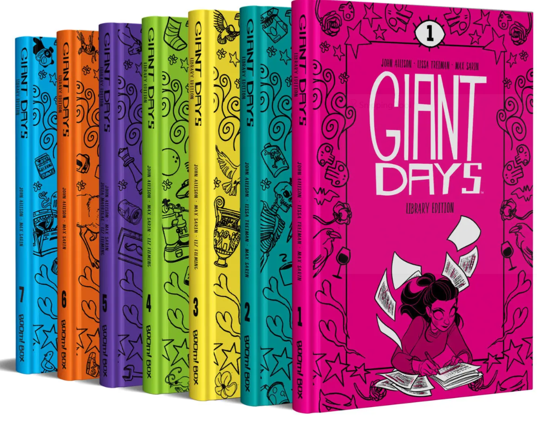 Photograph of seven different colored volumes of Giant Days