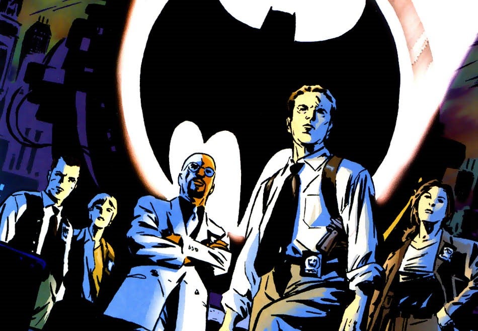 cropped image of cover of Gotham Central featuring the central cast on the roof and the Bat Signal behind them