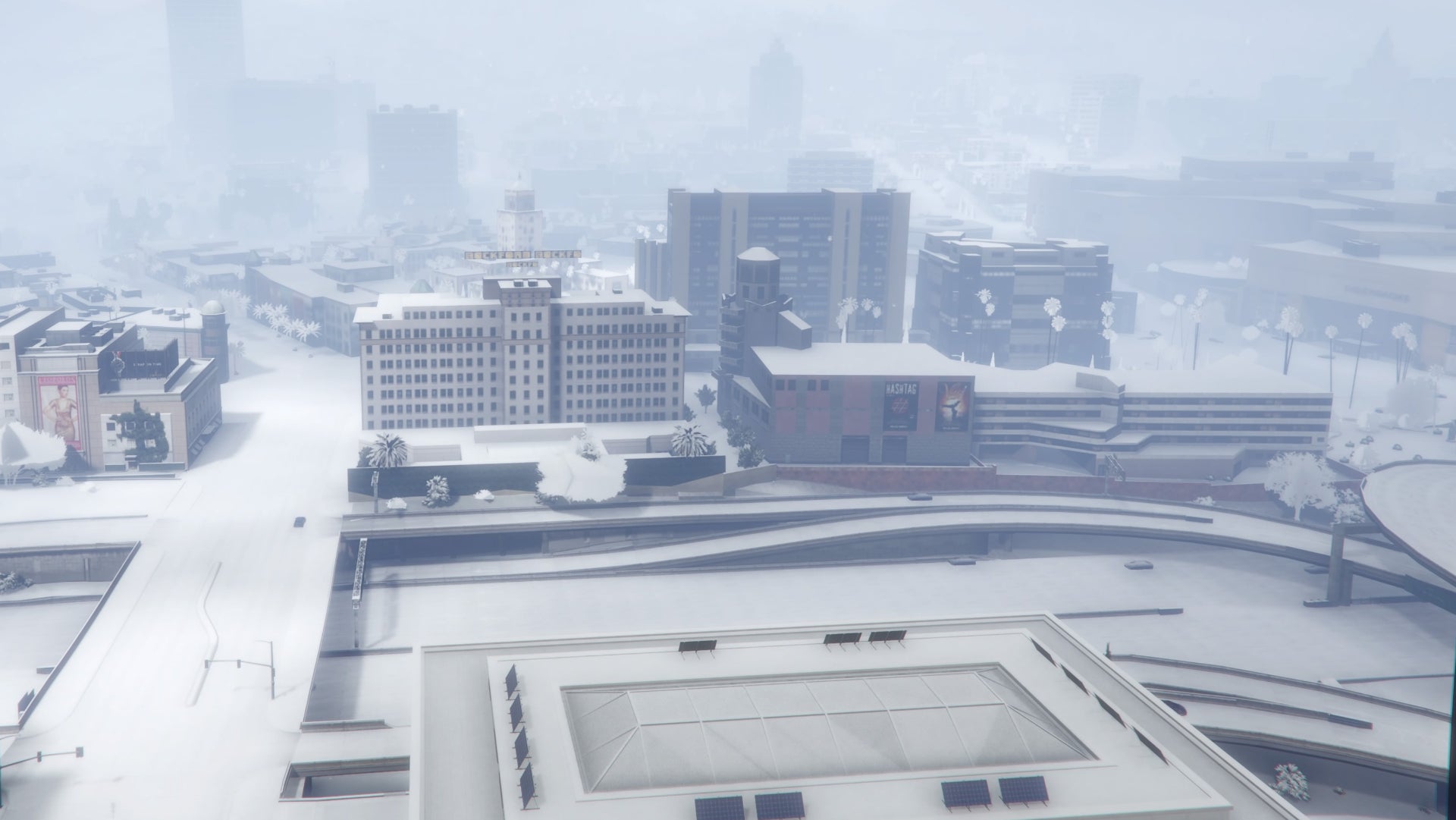 GTA Online, a penthouse view of downtown and the freeway during the annual snowfall.