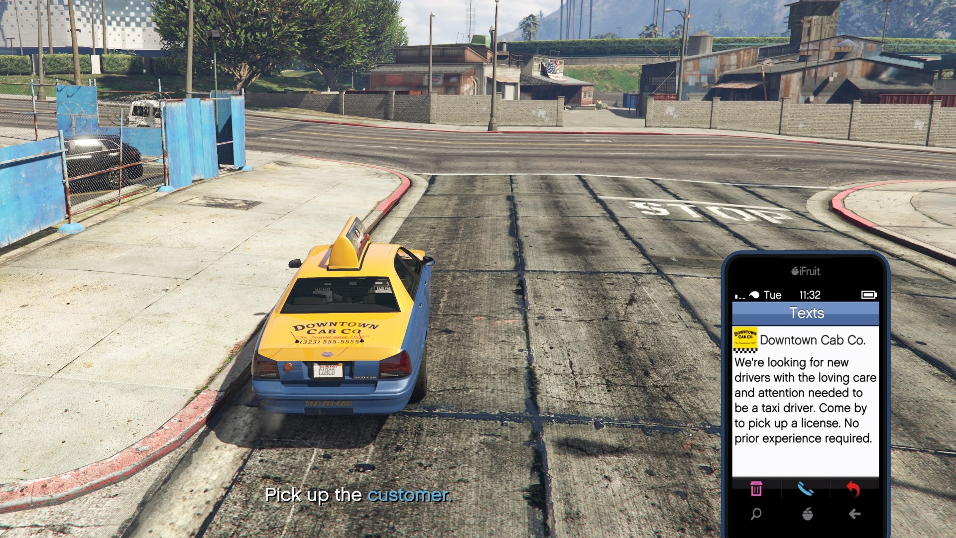 GTA Online, a Taxi Cab is in the road and on the phone is a text from Downtown Cab Company