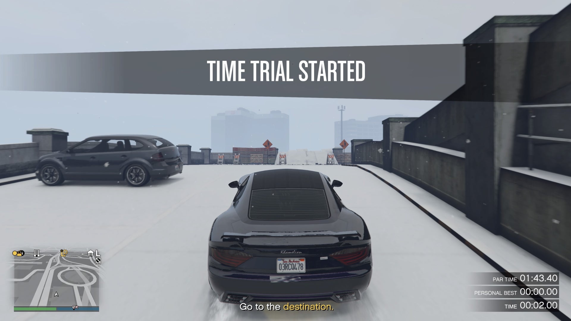 GTA Online, time trial starting at LSIA on the top of a car park, the vehicle in the middle of the screen is a dark purple Khamelion