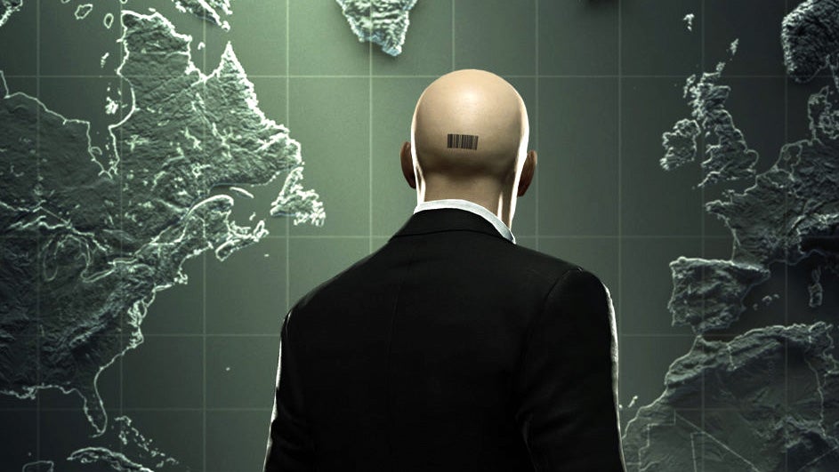 The suited and bald-headed Agent 47, turned away from the camera and looking at a map. The barcode on the back of their head is visible.
