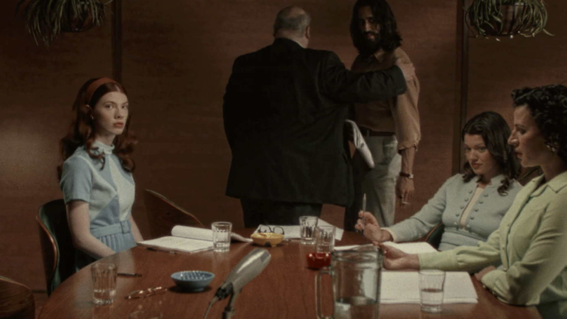 Immortality screenshot, characters arguing around a table