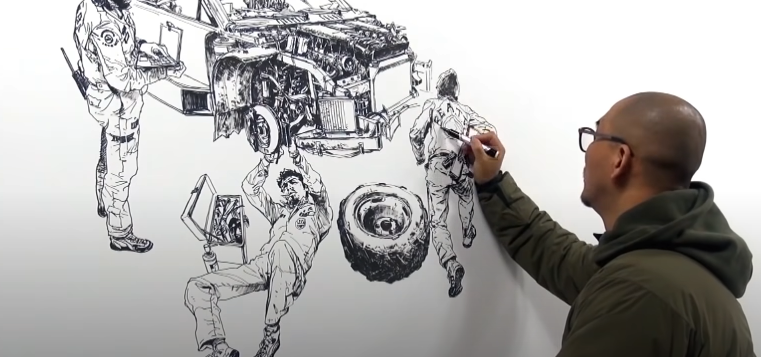 Screenshot image of Kim Jung Gi drawing on a large sheet of paper with pen
