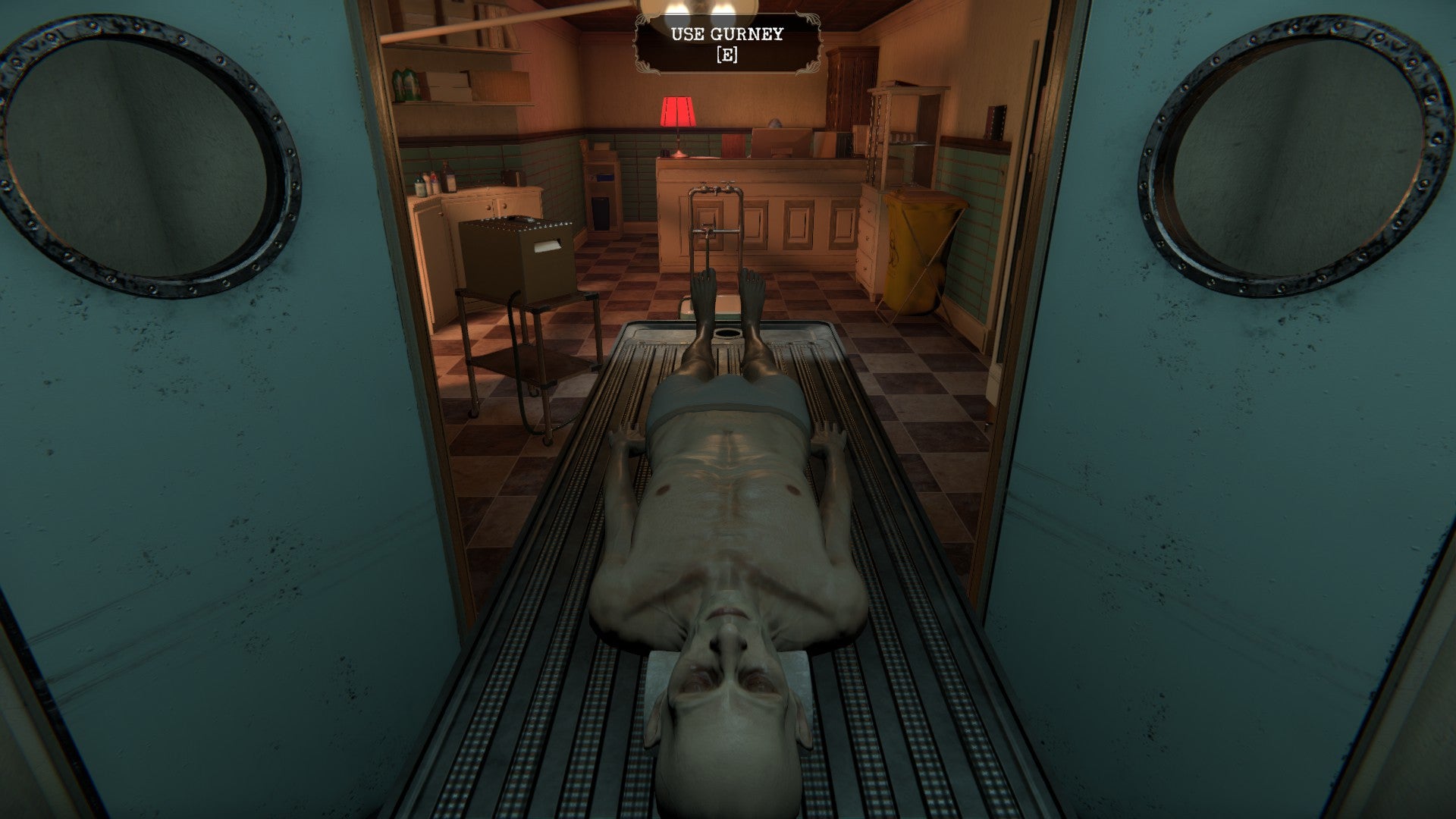 The body of an elderly man on a mortuary trolley, moving between rooms.