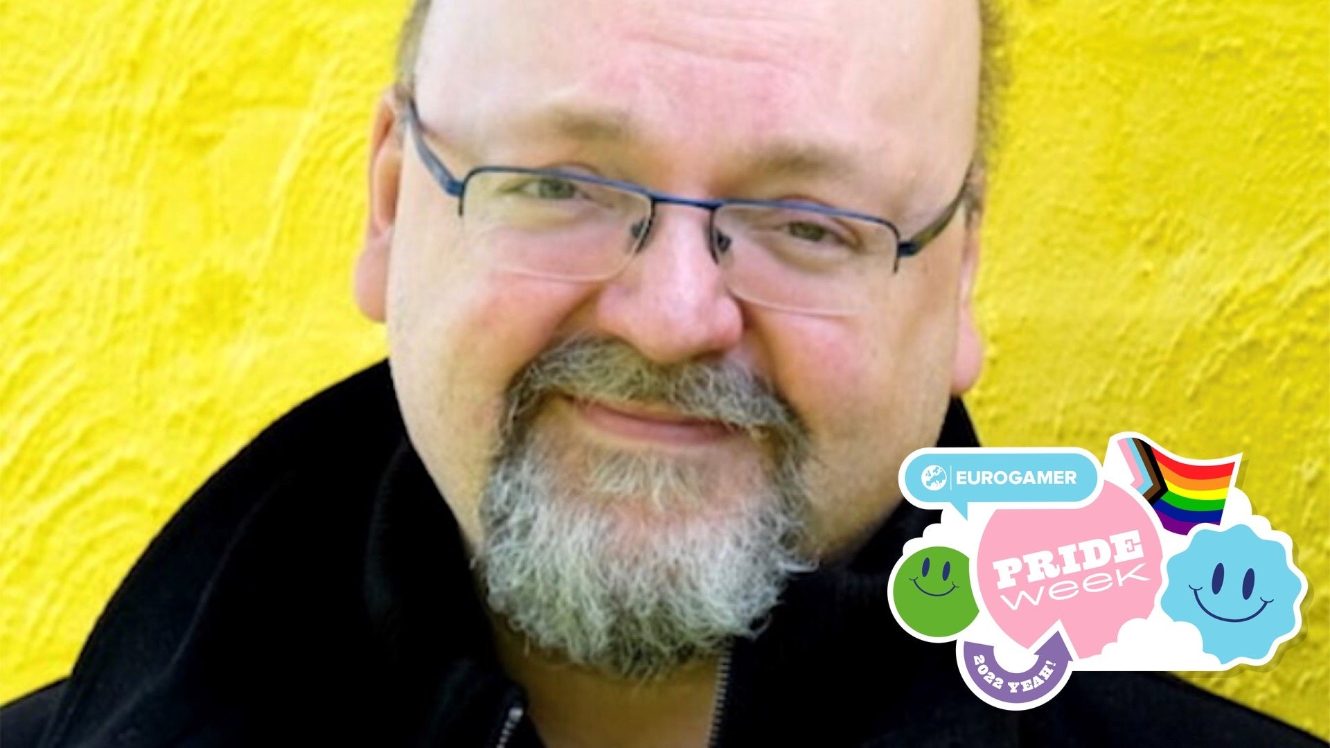 A headshot of former BioWare legend David Gaider, smiling slightly against a glorious, sunshine yellow background. Very nice.