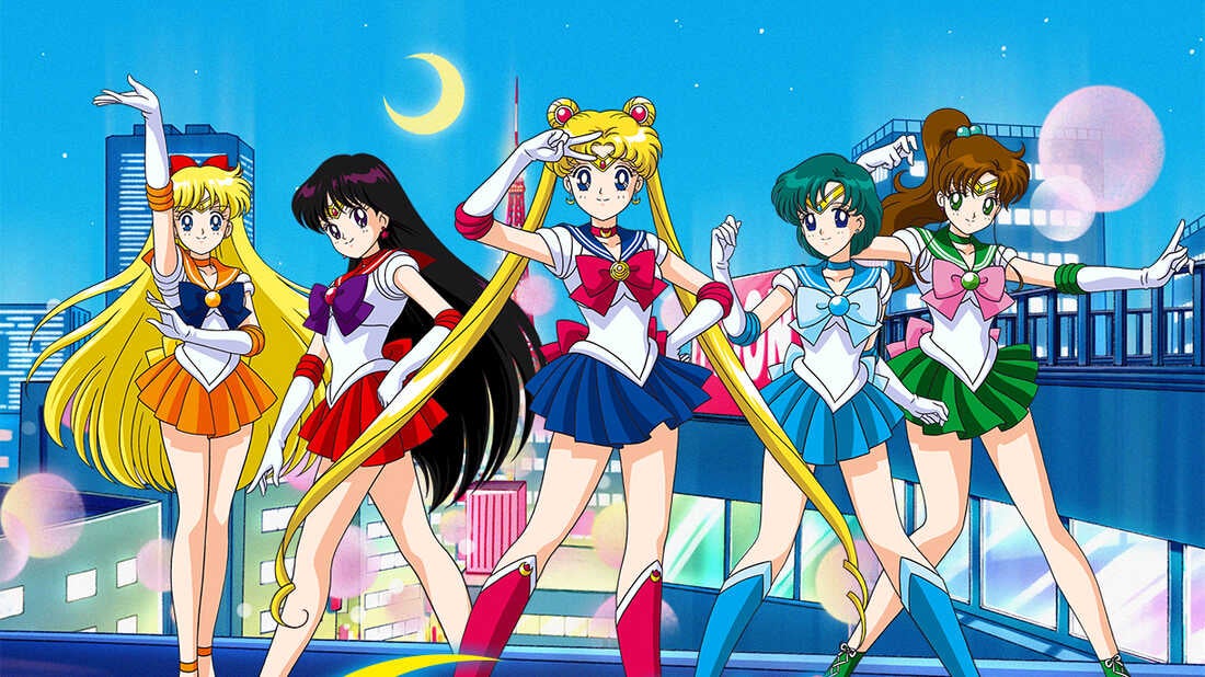 Sailor Moon still, from left to right there is Sailor Venus, Sailor Mars, Sailor Moon, Sailor Neptune, and Sailor Jupiter all striking poses