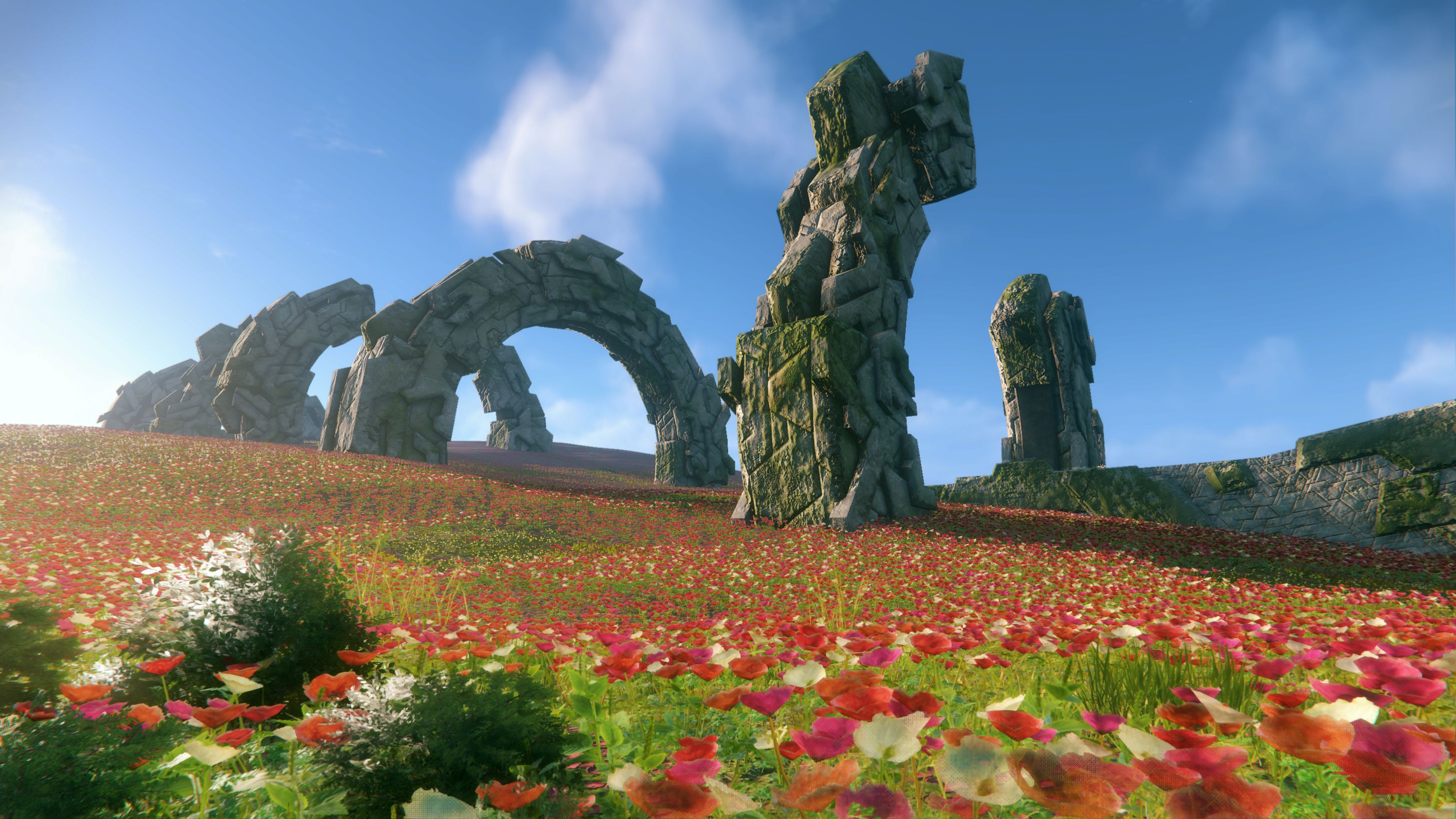 Sonic Frontiers preview - a field of red poppy-like flowers with hoop-shaped ruins and arches