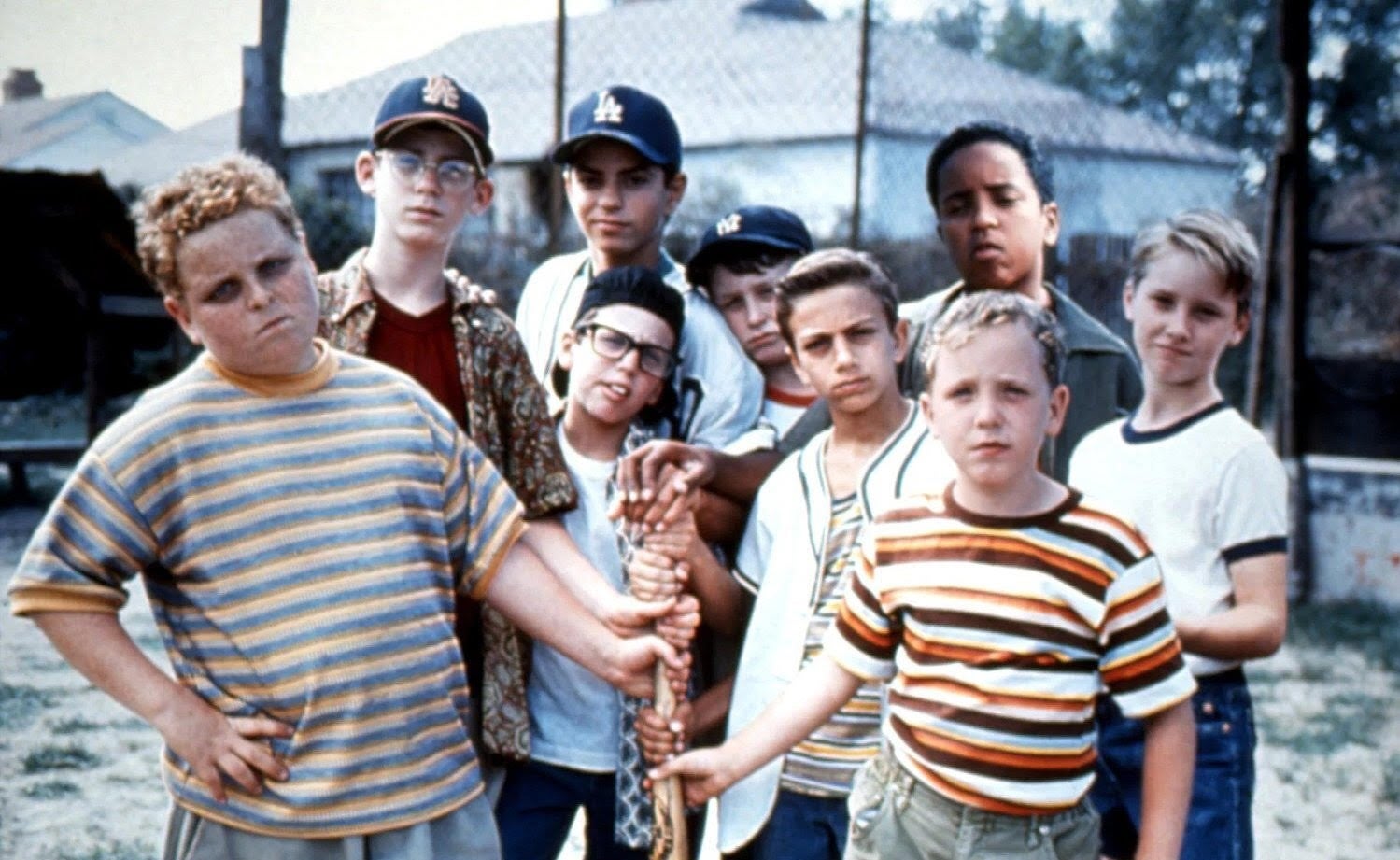 Photograph of the cast of the Sandlot in character, holding a bat