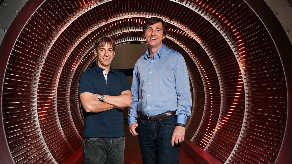 Zynga's Mark Pincus (left) and Don Mattrick standing in a weird red tunnel